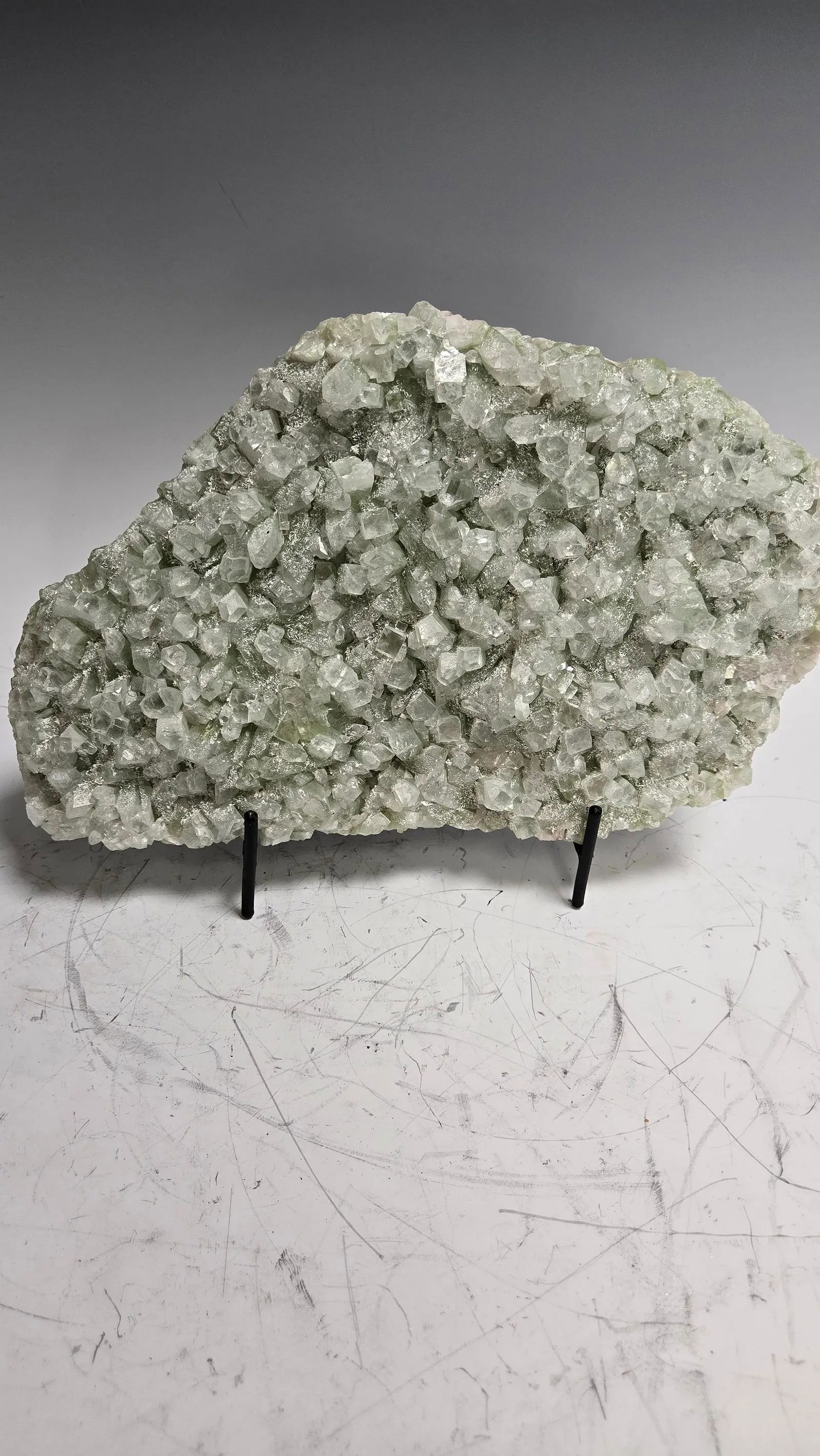 AN APOPHYLITE SPECIMEN INDIA: Green in color. 11" long.