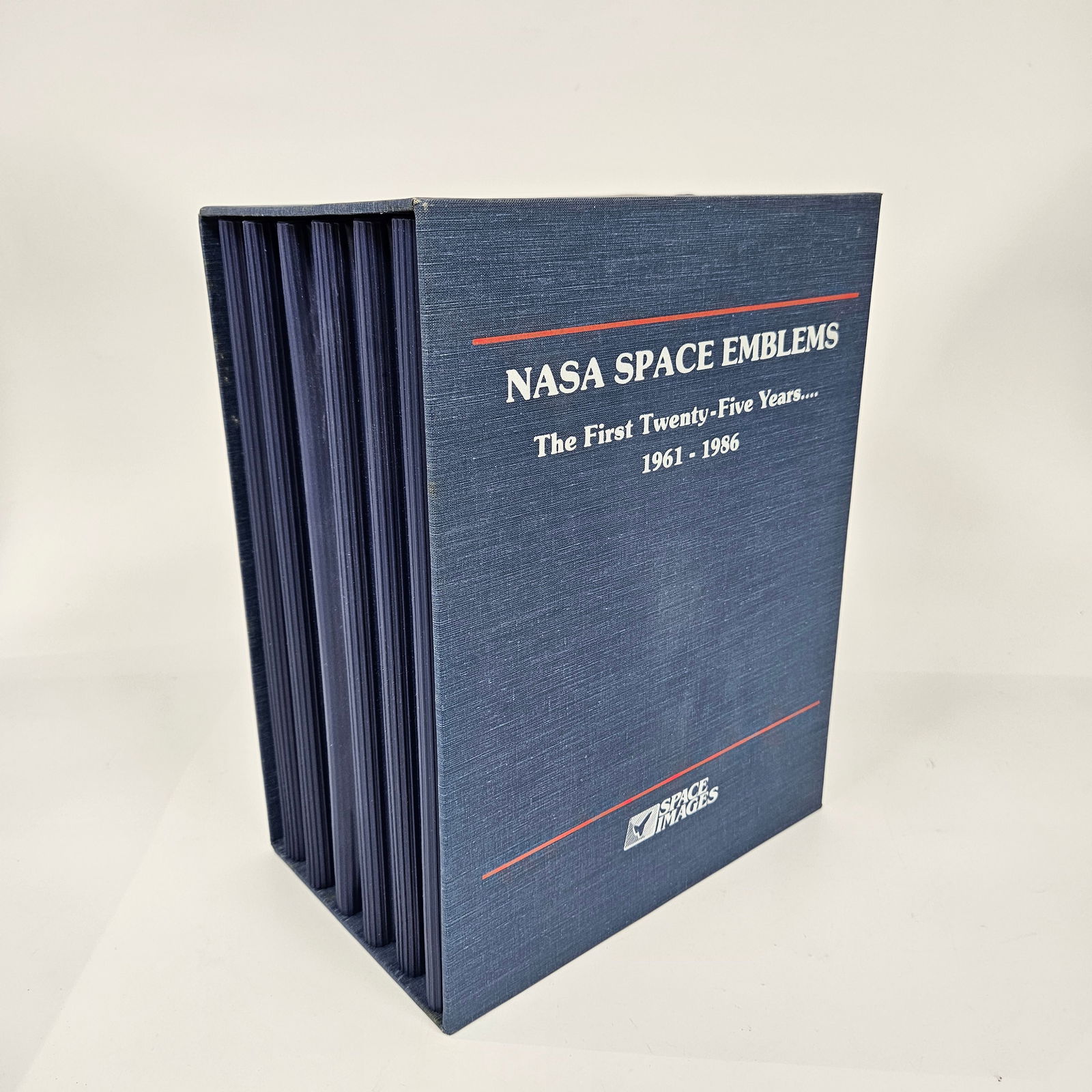 NASA SPACE EMBLEMS: THE FIRST TWENTY FIVE YEARS.: A collection of patches/emblems publised by Space Images from each of the missions from 1961 -1986.