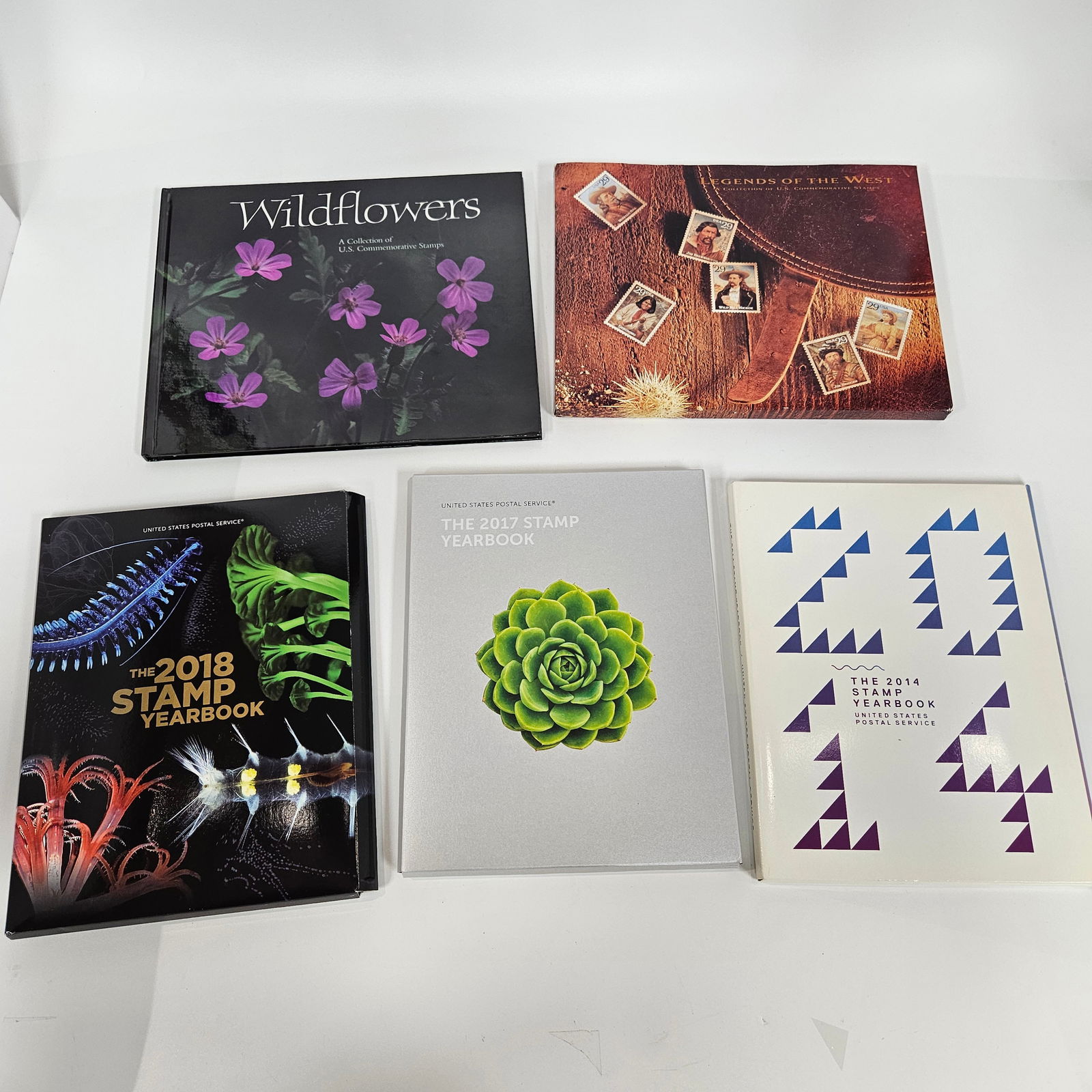 A GROUP OF AMERICAN AND ISRAELI UNUSED POSTAGE STAMPS AND ROYAL SHEETLETS: Includes a group of unused stamps including many yearly sets. Included are 2014. wildflowers, Legends of the West, Hitchcock, 2018, 2017 and many other stamps.. accompanied by many royal