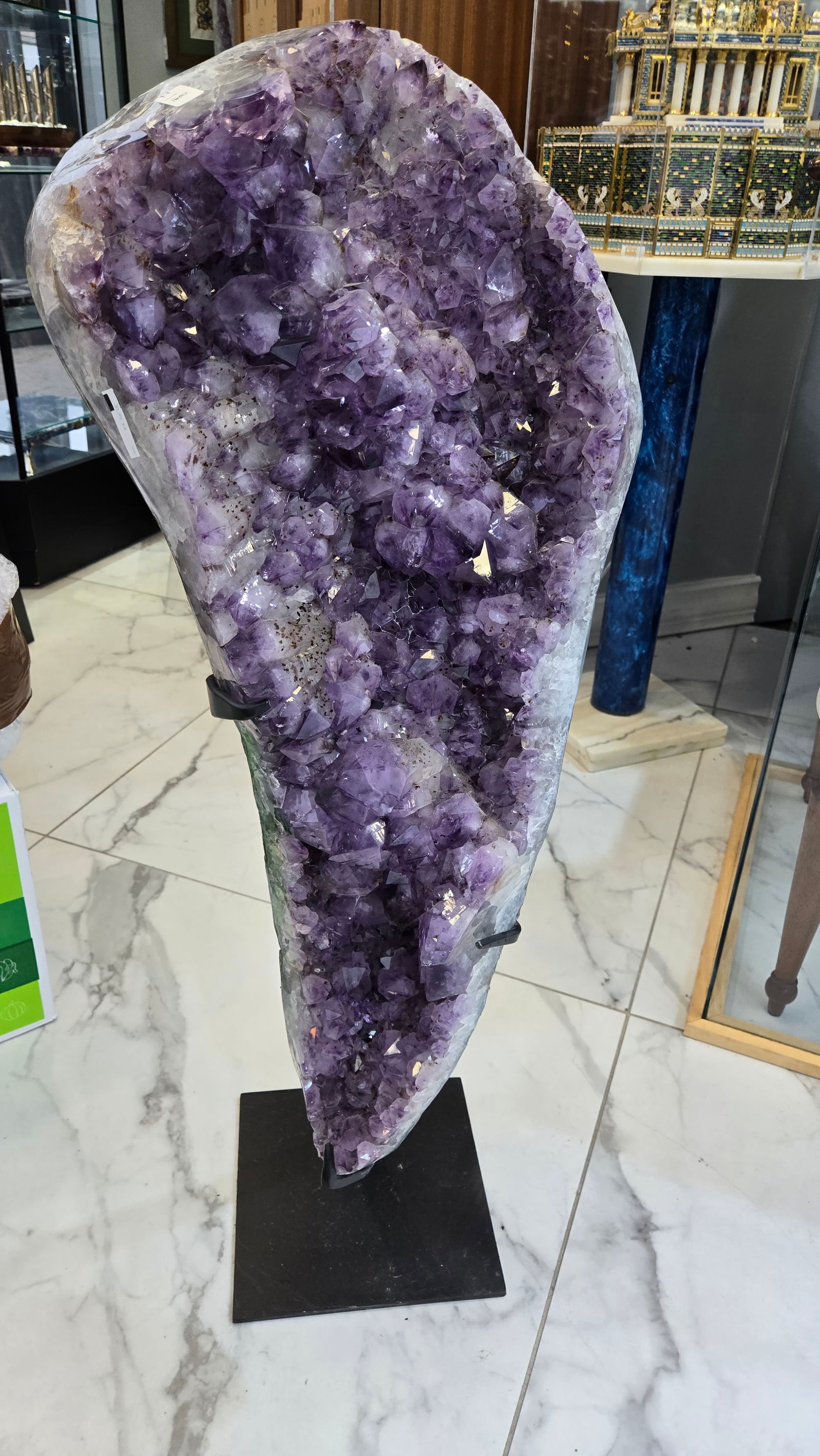 A MAGNIFICENT AMETHYST CLUSTER ON A STAND.: Large and small crystal formation. Deep purple color. 42" tall including stand. Stone itself is 32" x 16"