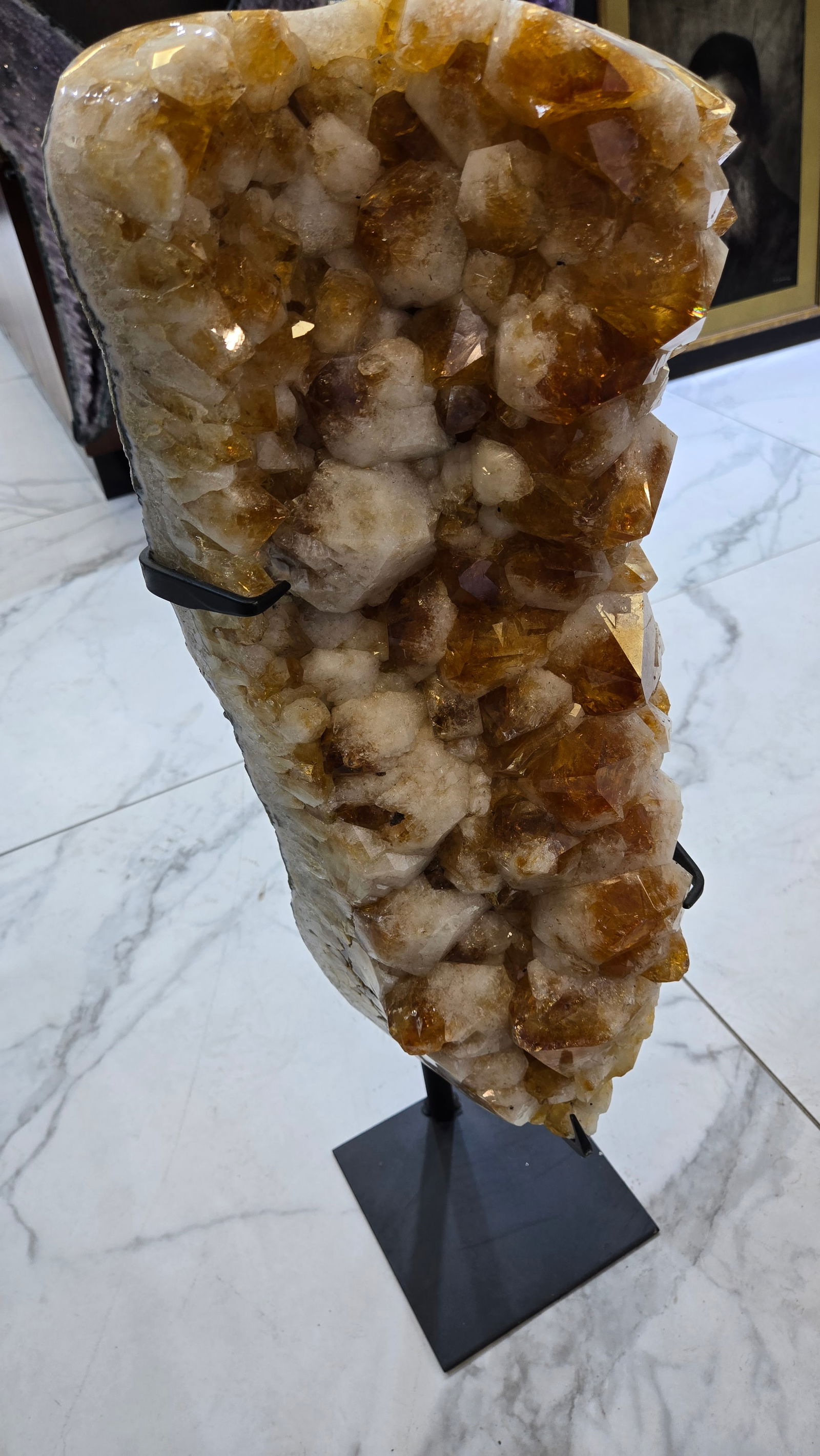 A MAGNIFICENT CITRINE CLUSTER ON A STAND: This cluster includes large and small crystals. The stone itself is 20" tall and 32" on the stand.