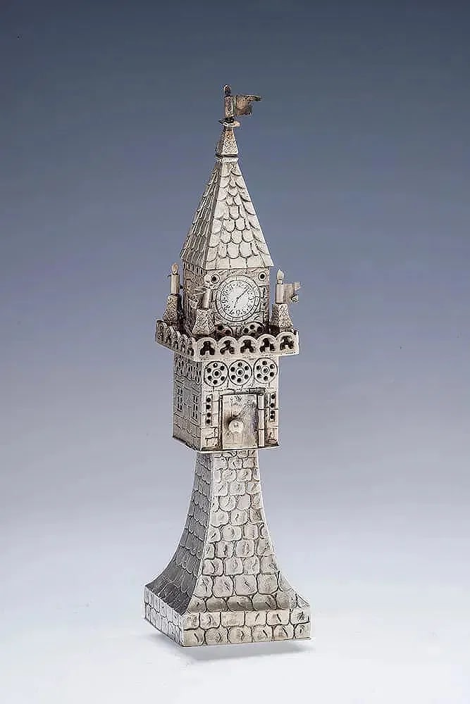 A LARGE ANTIQUE SILVER SPICE TOWER BY GEBRUDER GUTGESELL C. 1880: Germany, c.1880. Hand chased. The base is in layered cobblestone form that attaches to a square main section with pierced round and rectangular windows. The upper turret is fitted with four waving