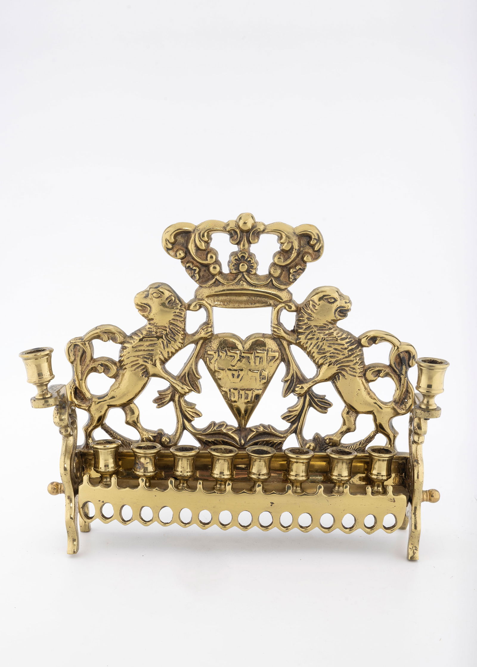 A BRASS HANUKKAH LAMP. Poland or USA, c. 1900 (1 of 1)