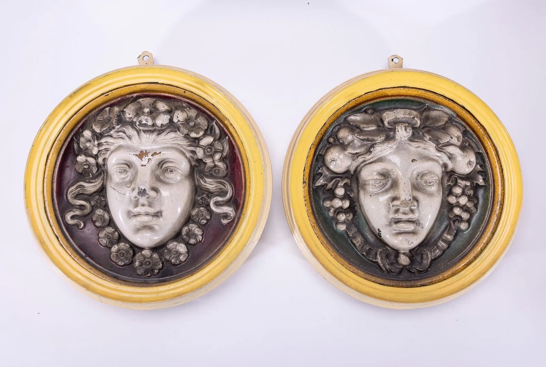 AN EXCEPTIONALLY RARE PAIR OF MAW & CO WALL EARTHENWARE RELIEFS.: Worcester, 19th century. Of Greek faces, the front is glazed ceramic, with frame and earthenware back. 11.6" diameter