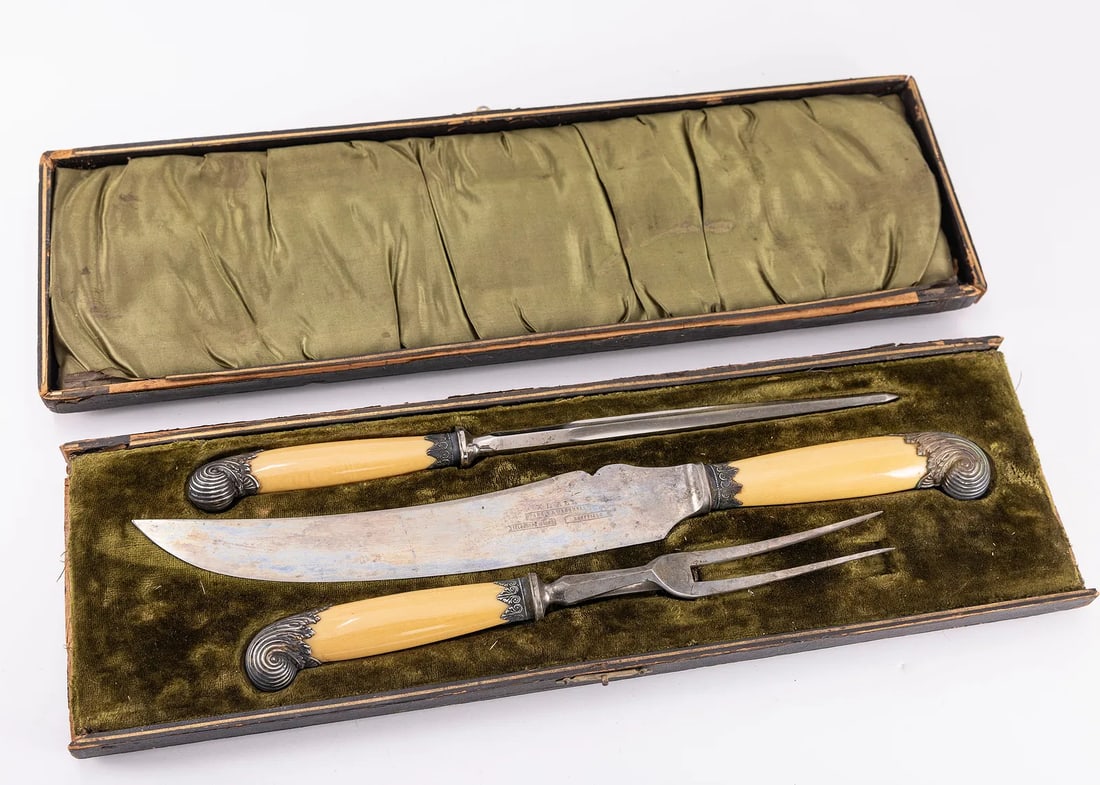 A LARGE BAKELITE AND STEEL CARVING SET. Sheffield: Manufactured by Parkin and Marshall, in sheffield England. In original presentation box. 16.8" with box