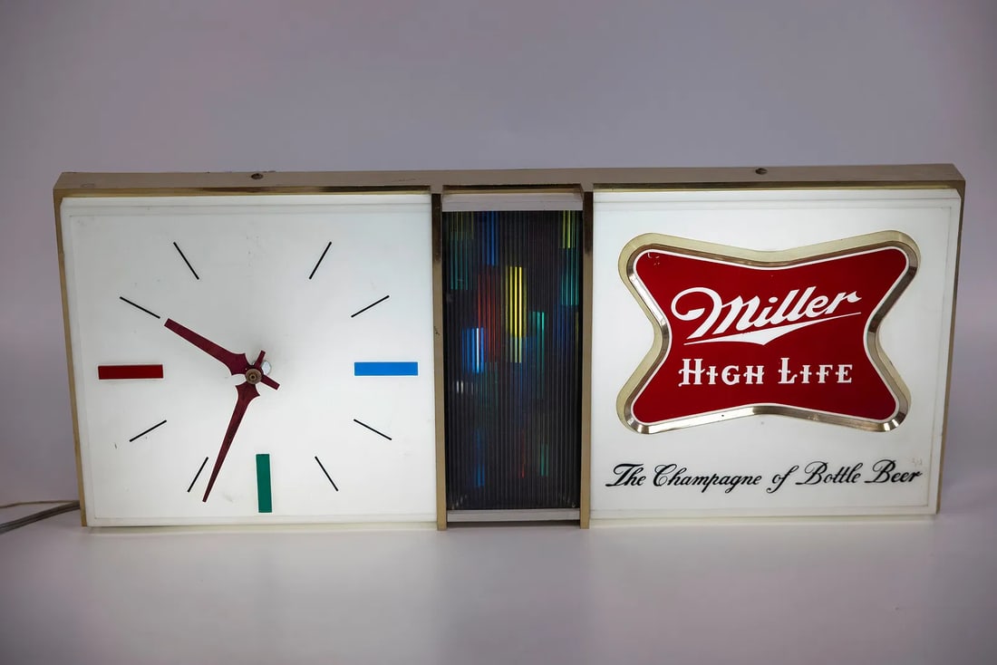 A MILLER HIGH LIFE LIGHTER CLOCK SIGN. United States, c. 1960 (1 of 4)