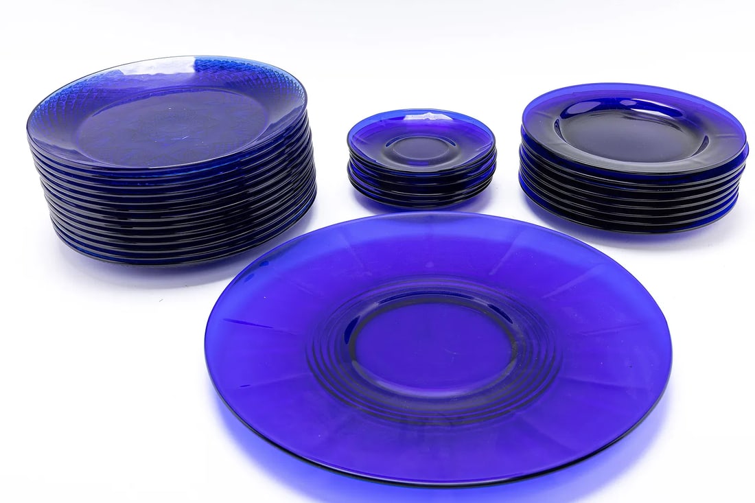 A LARGE COLLECTION OF BLUE GLASS PLATES.: 1 large 13.7" wide plate. 13 blue 10.1" wide plates. 8 blue 8.5" wide plates. 6 blue 5.8" wide plates