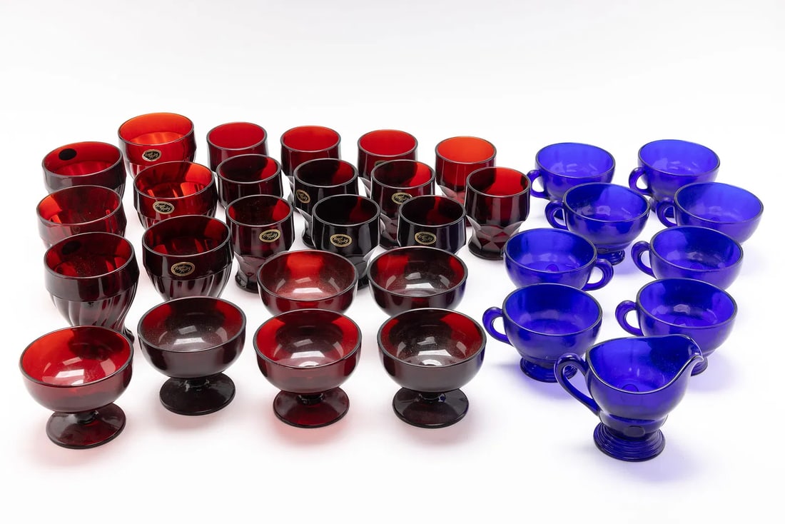 A COLLECTION OF 32 ART DECO PERIOD GLASSWARE.: Various sizes and colors. Most ruby colored and blue.