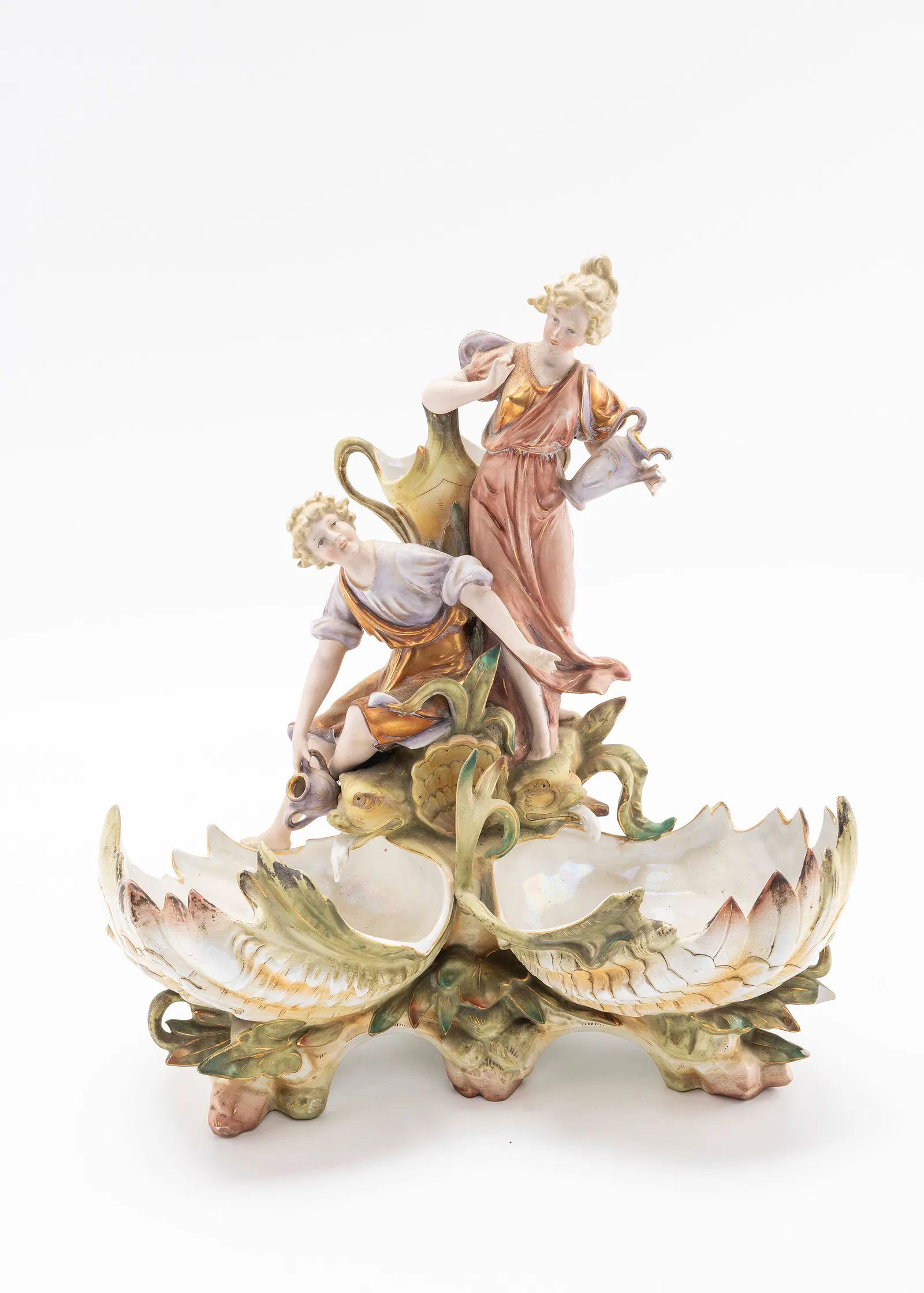 A MEISSEN PORCEIAN FIGURINE. Germany early 20th: Of a young couple in action. The fingers on one hand is broken and the small pitcher handle is broken. 13.4" tall