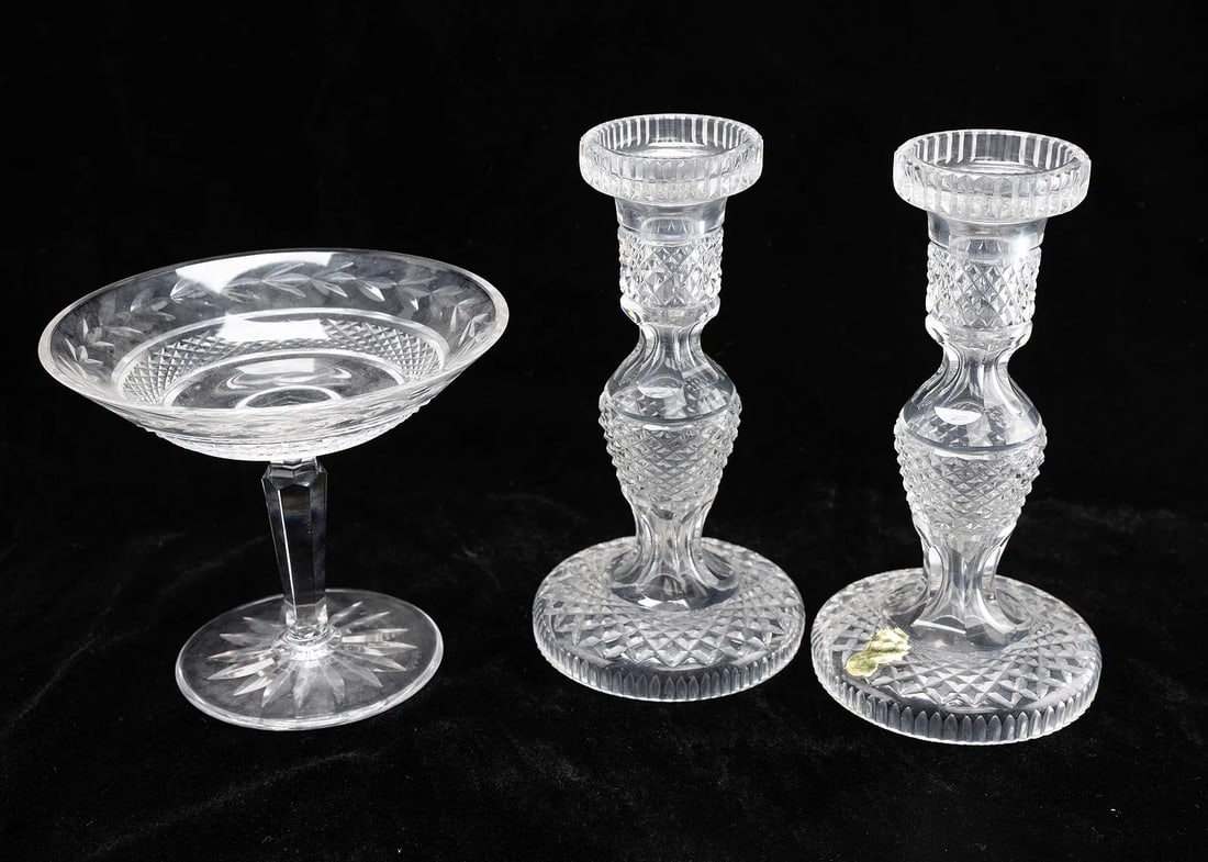 A PAIR OF CRYSTAL CANDLESTICKS AND A COMPOTE. (1 of 1)