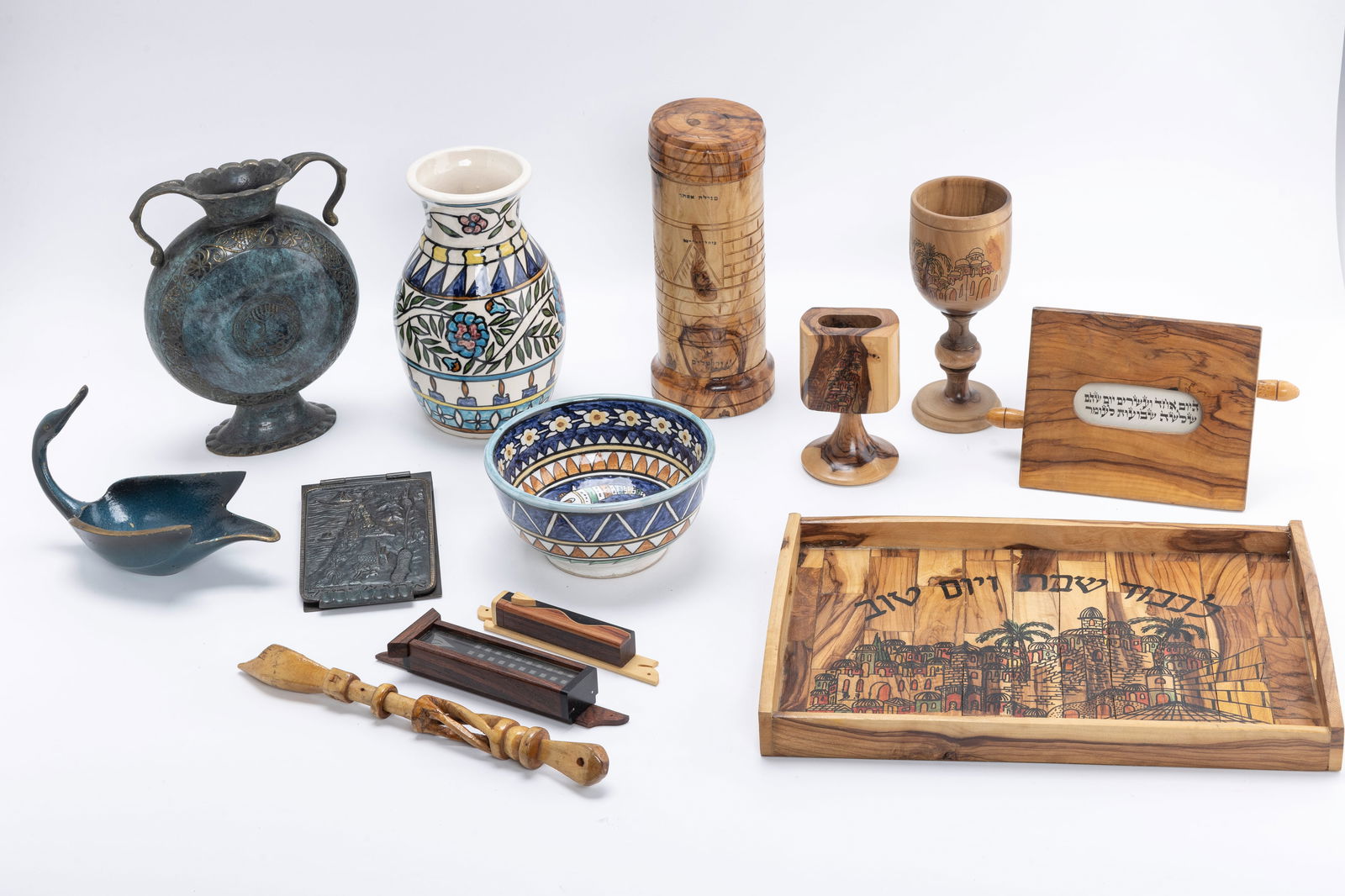 A COLLECTION OF ISRAELIANA. Pallbell, olivewood and pottery (1 of 1)