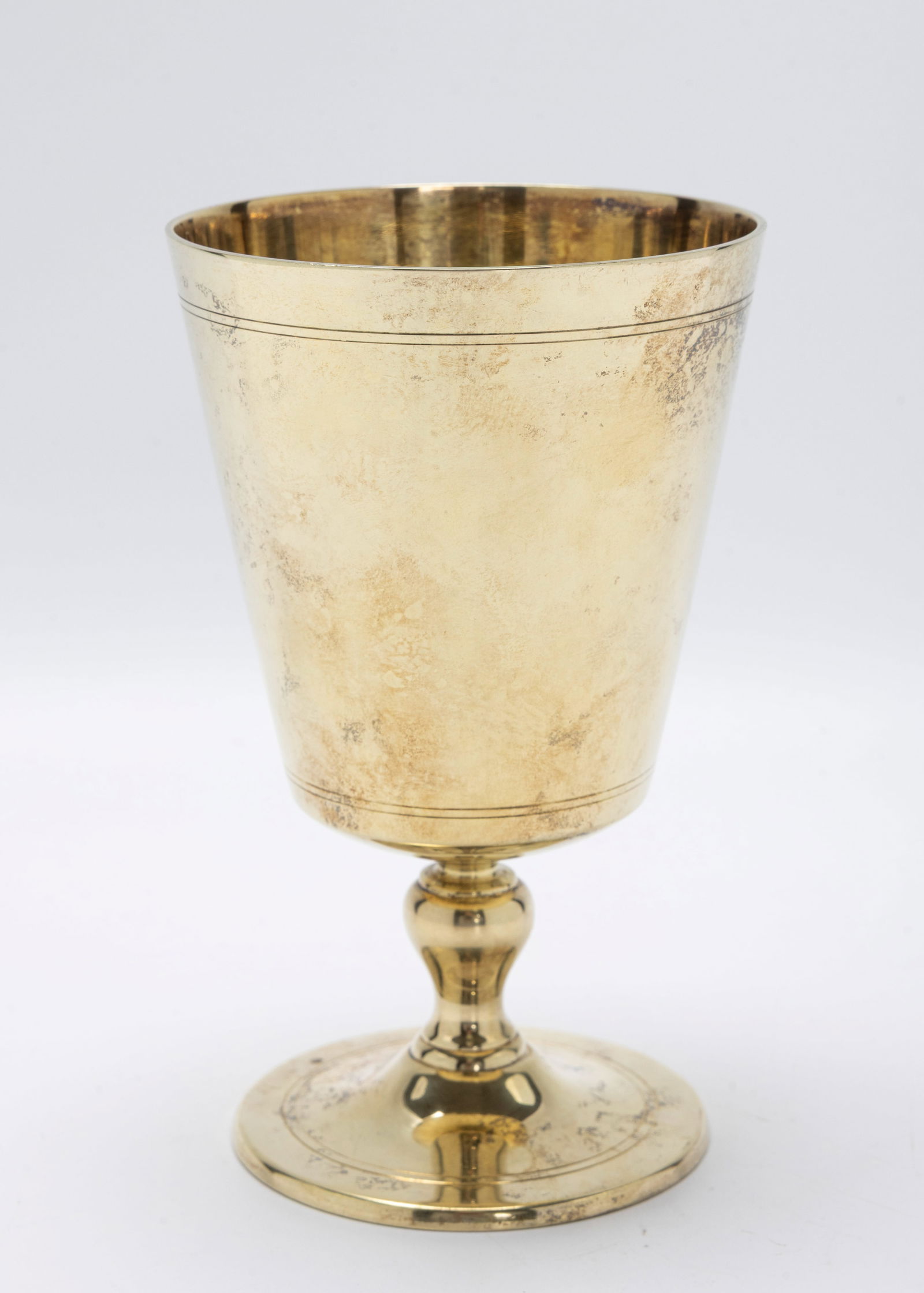 A PARCEL GILD STERLING SILVER KIDDUSH CUP BY TIFFANY AND COMPANY.: New York, c. 1990. Traditional form goblet. 5.5" tall and 247.1 grams