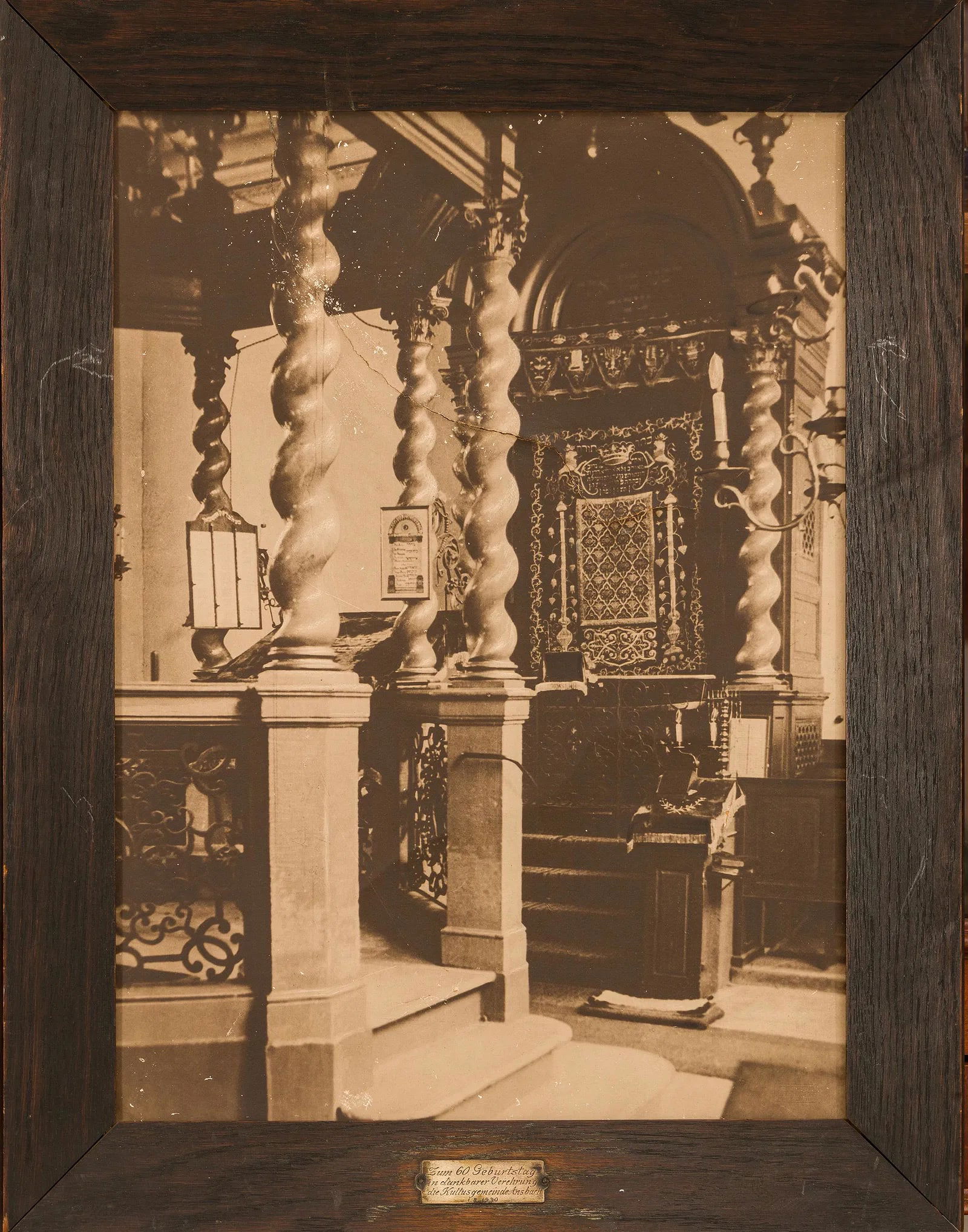A LARGE EARLY BLACK AND WHITE PHOTO OF INTERIOR OF THE ANSBACH SYNAGOGUE.Germany, 1930. Photographed: A LARGE EARLY BLACK AND WHITE PHOTO OF INTERIOR OF THE ANSBACH SYNAGOGUE.Germany, 1930. Photographed by Alfred Ortloff, Ansbach. In a commemorative frame with a silver plaque that reads â€œOn t