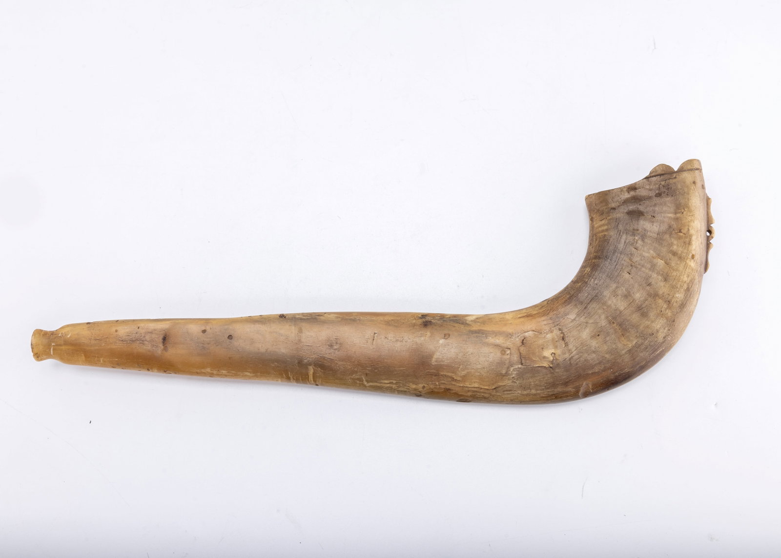 A RARE AND EARLY LARGE ANTIQUE SHOFAR. Germany, c. 1800: Traditional form. Hand pressed and carved. Some minor loss and cracks from age. 15.5" long.