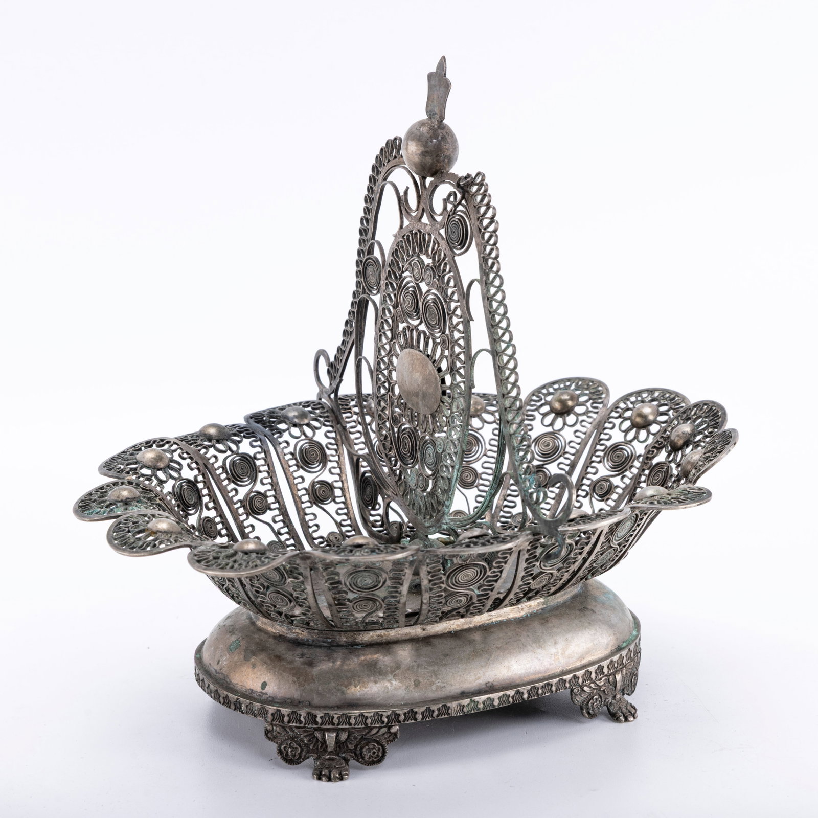 AN EARLY OTTOMAN FILIGREE BASKET.: The base is in oval form. The upper portion is filigree. Marked. 7.6" wide