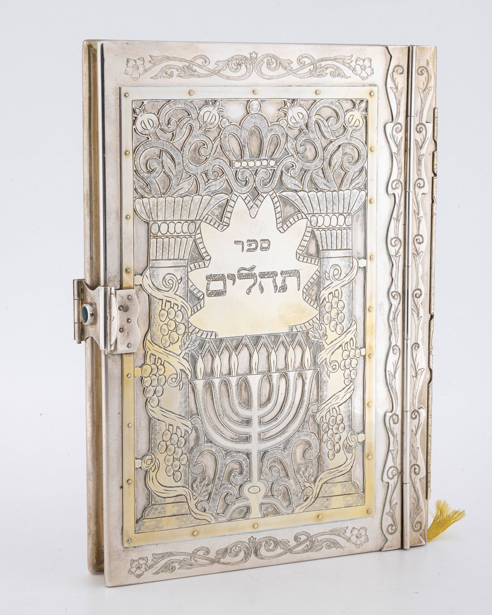 A STERLING SILVER TEHLLIM BINDING WITH ORIGINAL TEHILLIM BY SHUKI FREIMAN.: Hand made with traces of the original gilding. 6.2" wide 7.7" tall