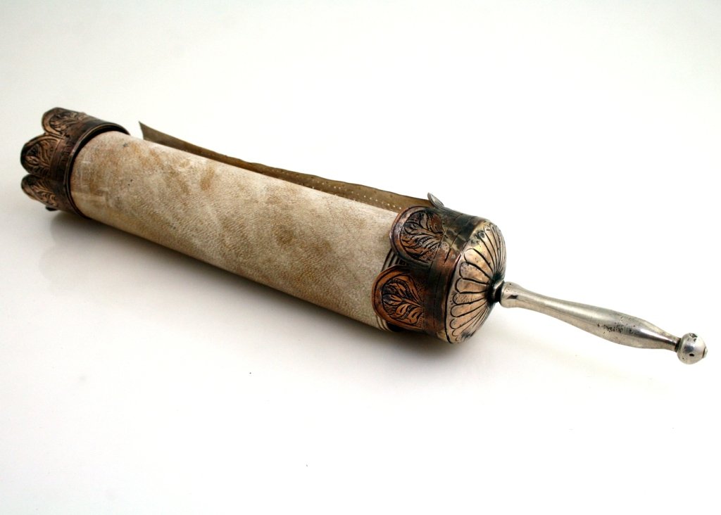 AN EARLY MEGILLAH ON SILVER BASE. Ottoman, 1893. With s: AN EARLY MEGILLAH ON SILVER BASE. Ottoman, 1893. With silver crown shaped upper and lower encasements and handle. Inscribed Joseph son of Jacob, 5650. Megillah incredibly well written. 11” long.