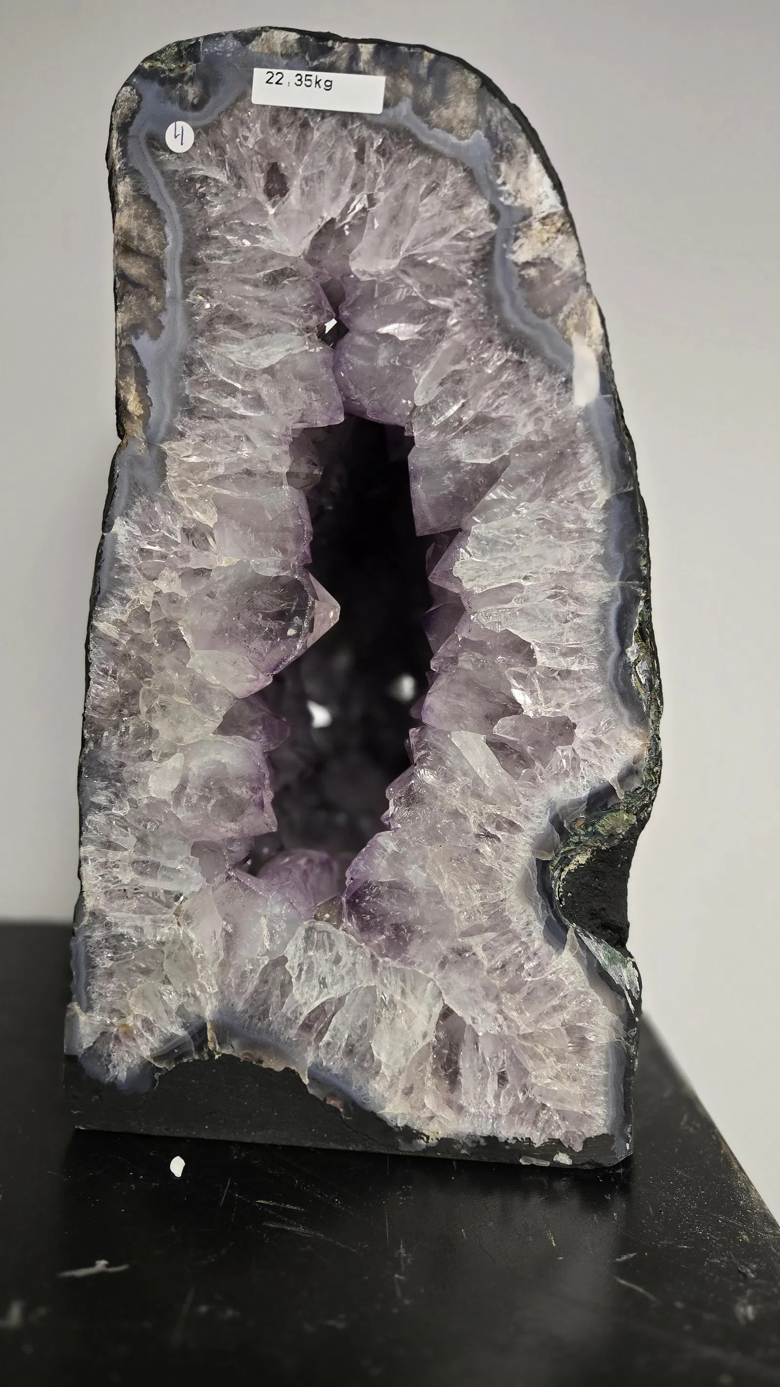 AMETHYST GEODE WITH POLISHED EDGES CATHEDRAL: Light purple in color. Polished edge. Triangular in shape. 14.5" tall and 23.5 kilograms