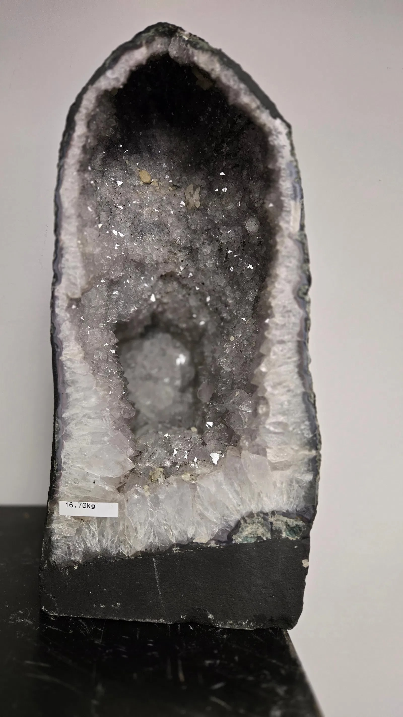AMETHYST GEODE WITH POLISHED EDGES CATHEDRAL: Light purple in color. Polished edge. Triangular in shape. 15" tall and 16.7 kilograms. Small piece missing from the top