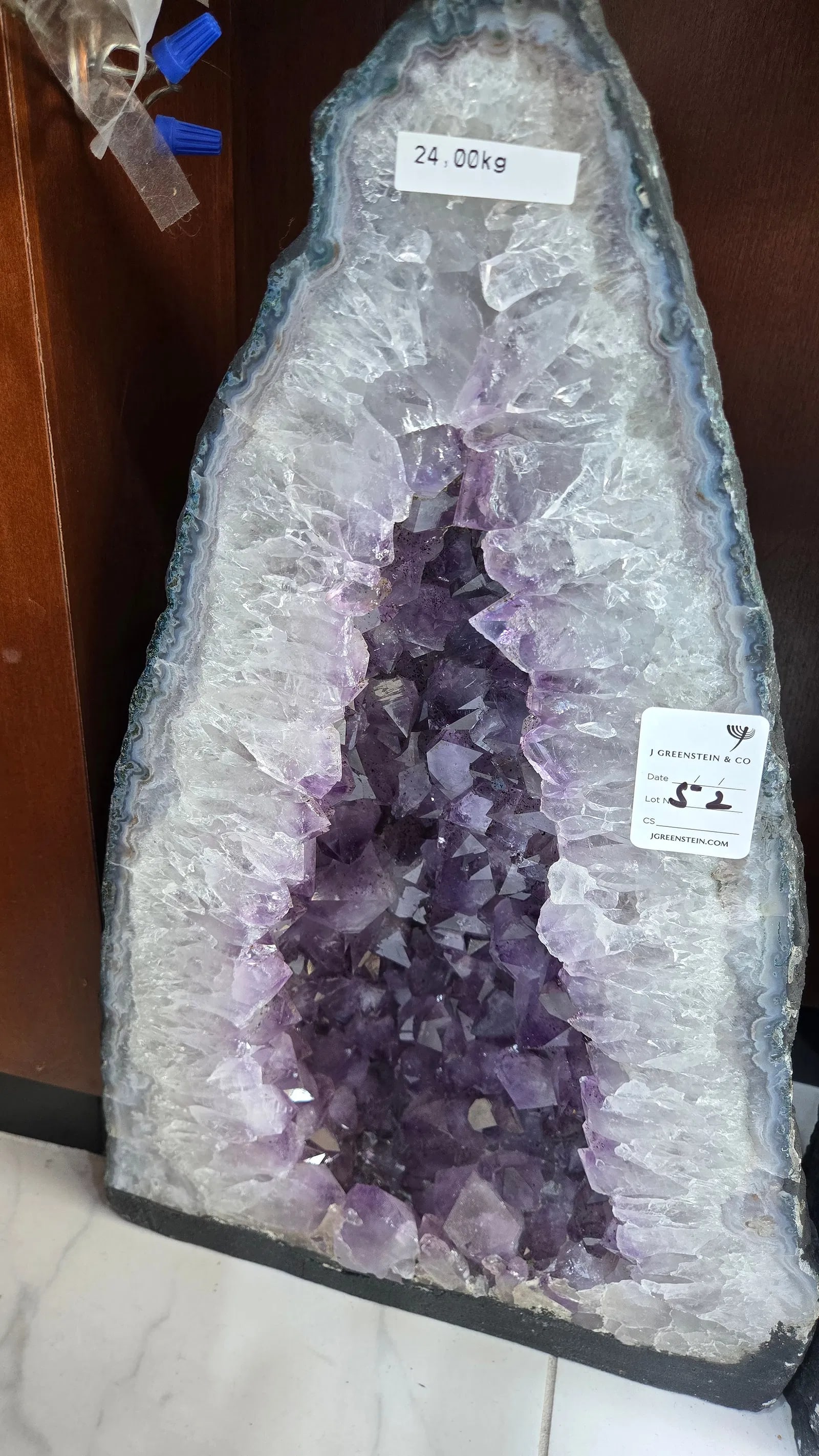 HIGHLY POLISHED AMETHYST GEODE. HUGE AND MAGNIFICENT: light purple in color. With a nice soft blue polished rim. 24 kilograms and 17" tall.