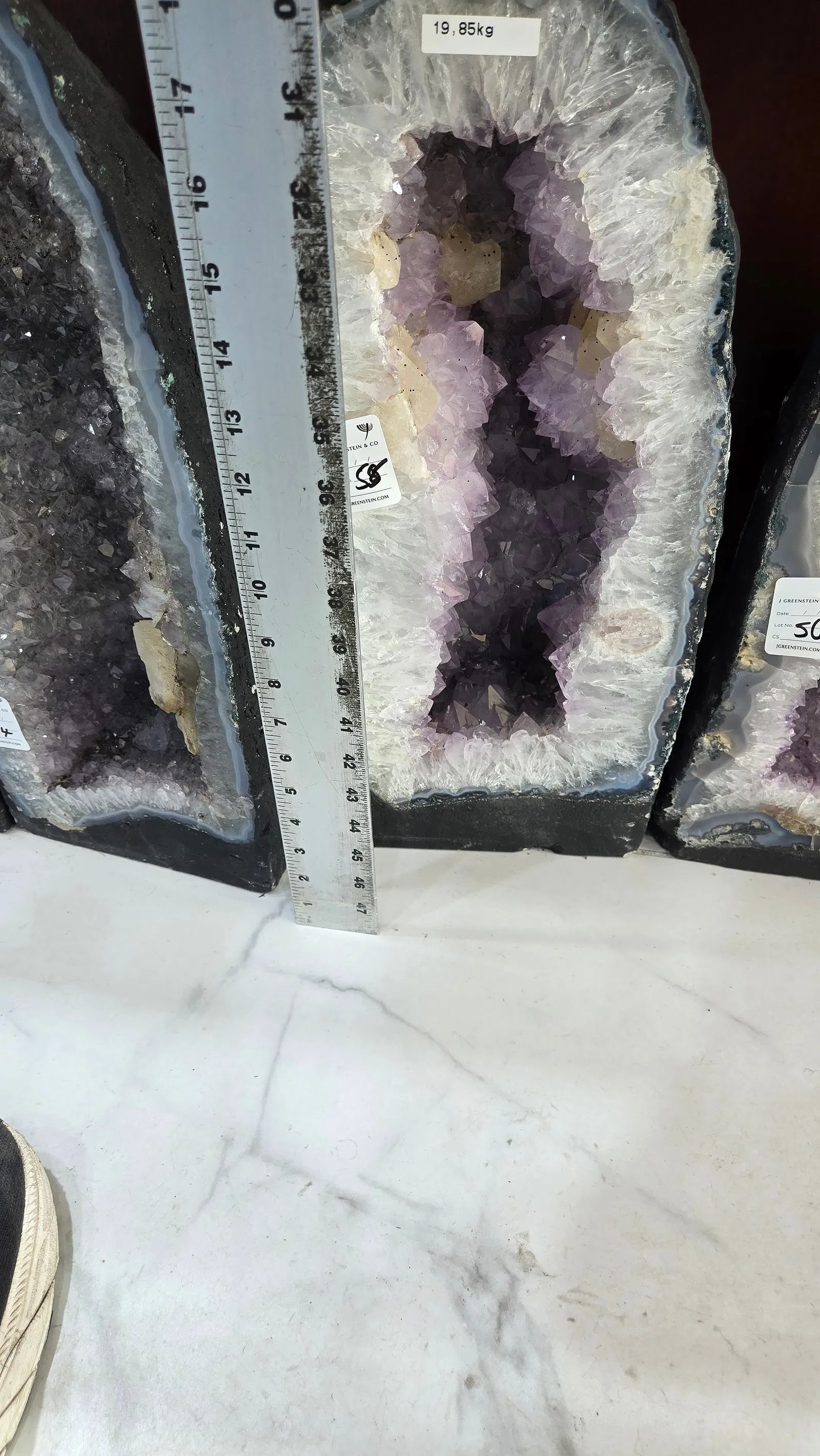 HIGHLY POLISHED AMETHYST GEODE. HUGE AND MAGNIFICENT: light purple in color. With a nice soft blue polished rim. 19.85 kilograms and 18" tall.