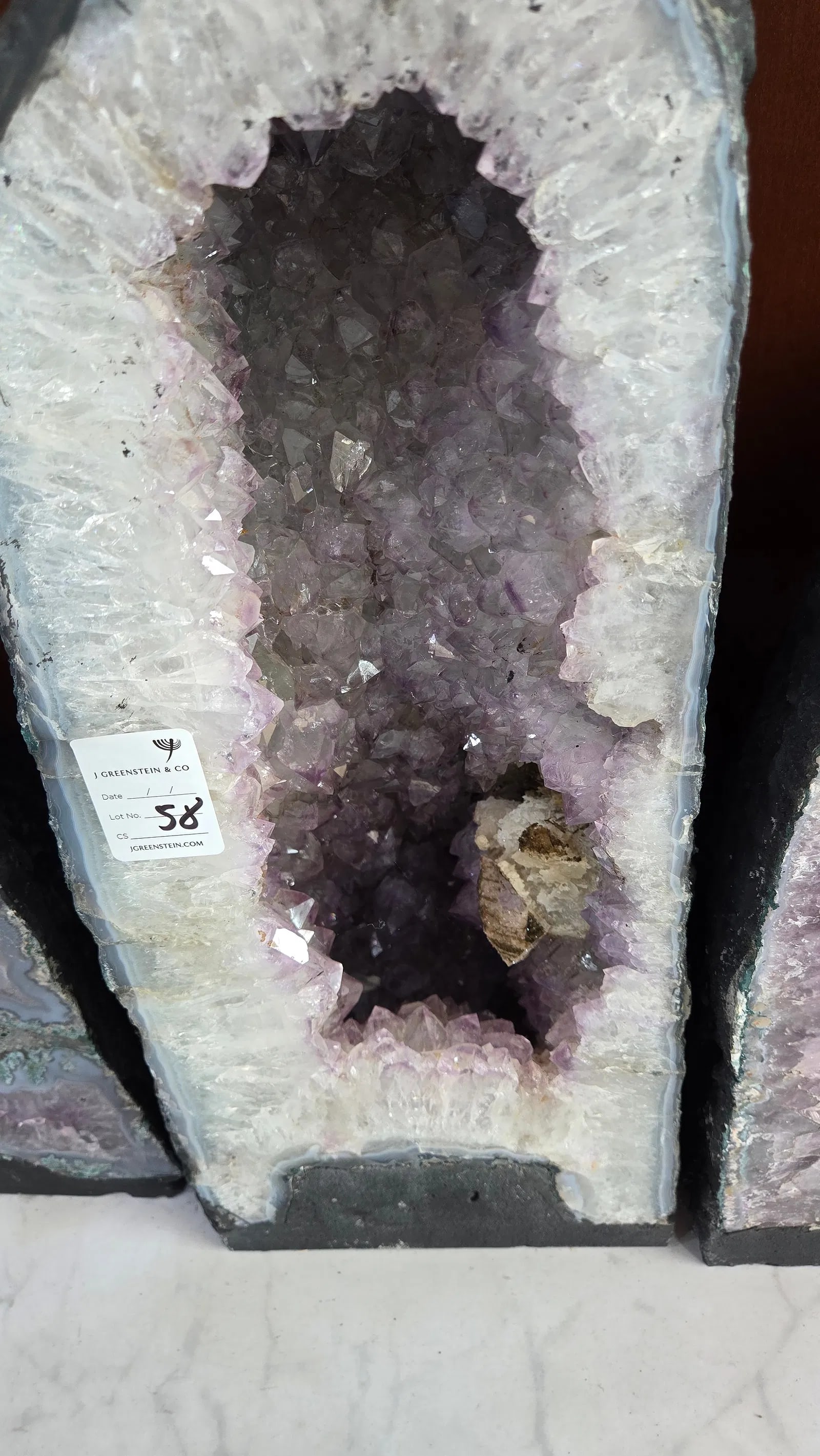 A LARGE AMETHYST GEODE POLISHED EDGES: 19.75 KILOGRAMS AND 17" TALL. Nice dark purple