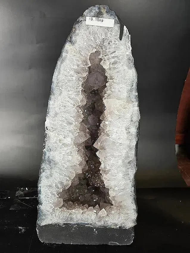 AMETHYST CATHEDRAL GEODE WITH POLISHED EDGES: 17" tall X 8" at its widest. It weighs 19.5 KILOGRAMS