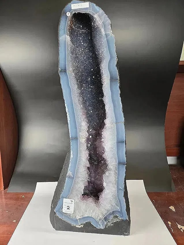 AMETHYST CATHEDRAL GEODE WITH POLISHED EDGES: 25.5" tall and 9.5" at it's widest. Weignt is 30.7 kilograms