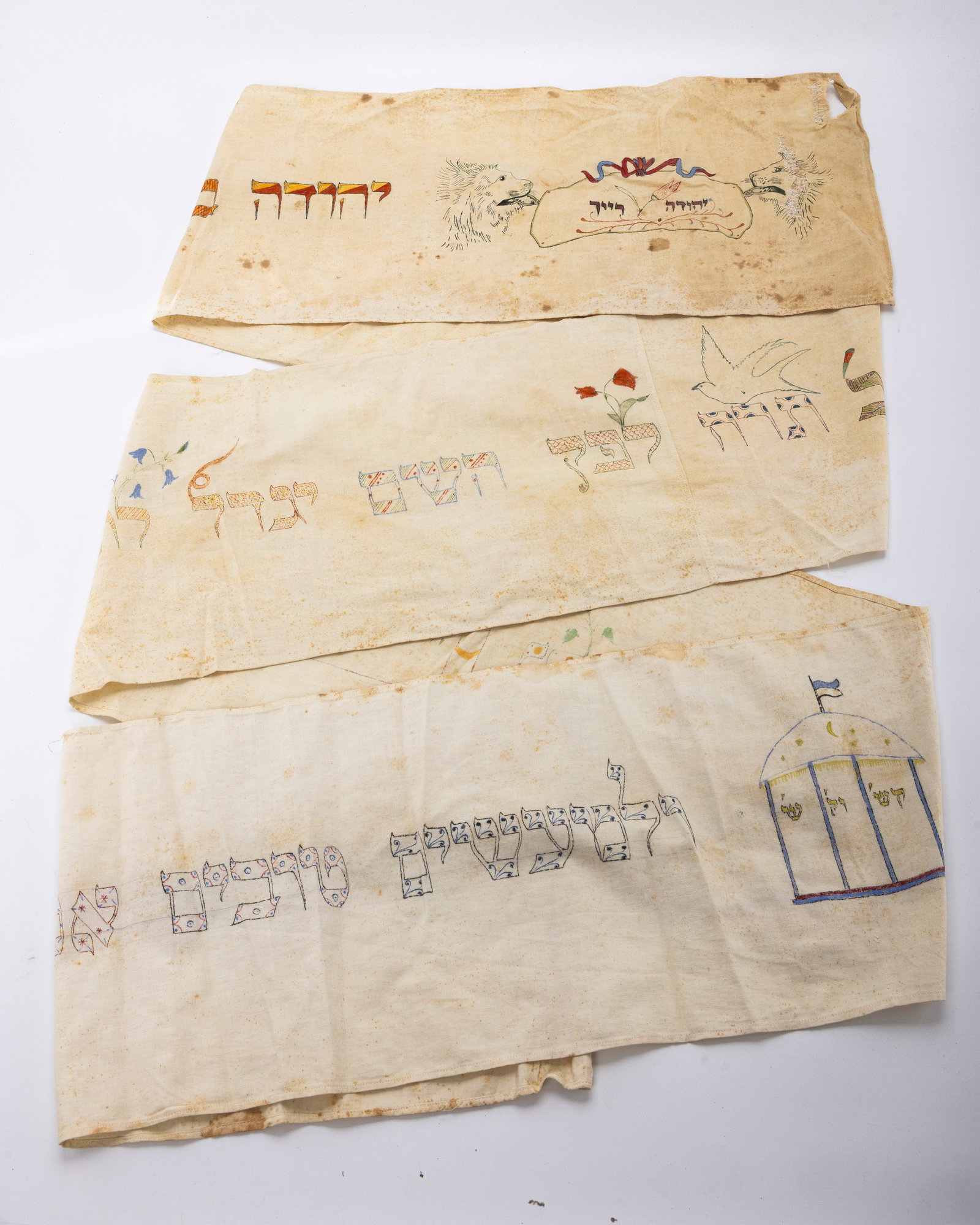 A LINEN TORAH WIMPLE. Germany, 1848.: On a white linen base. Embroidered with the name of the boy that who's bris it was as well as blessings and the year.