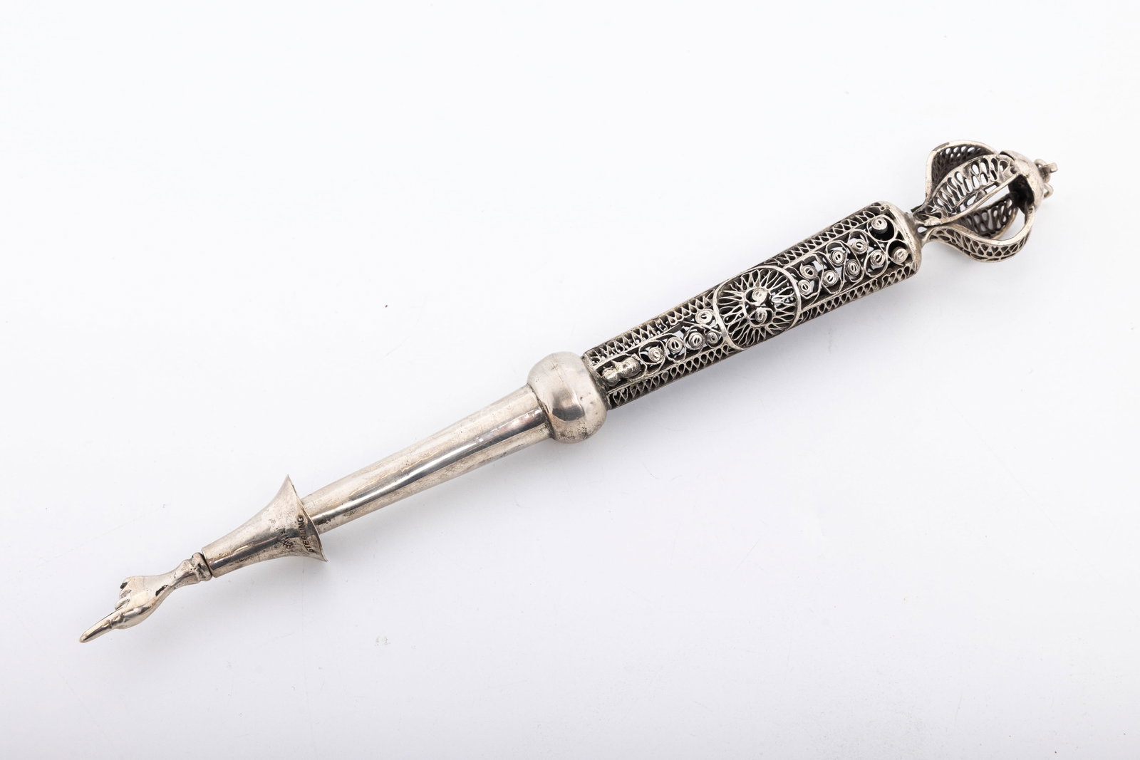 ANTIQUE STERLING SILVER TORAH POINTER. United States, c. 1920.: Hand spun filigree upper portion. Lower portion made of hand wrought sheet silver. With cuffed hand. 11.3" long. 105 grams.