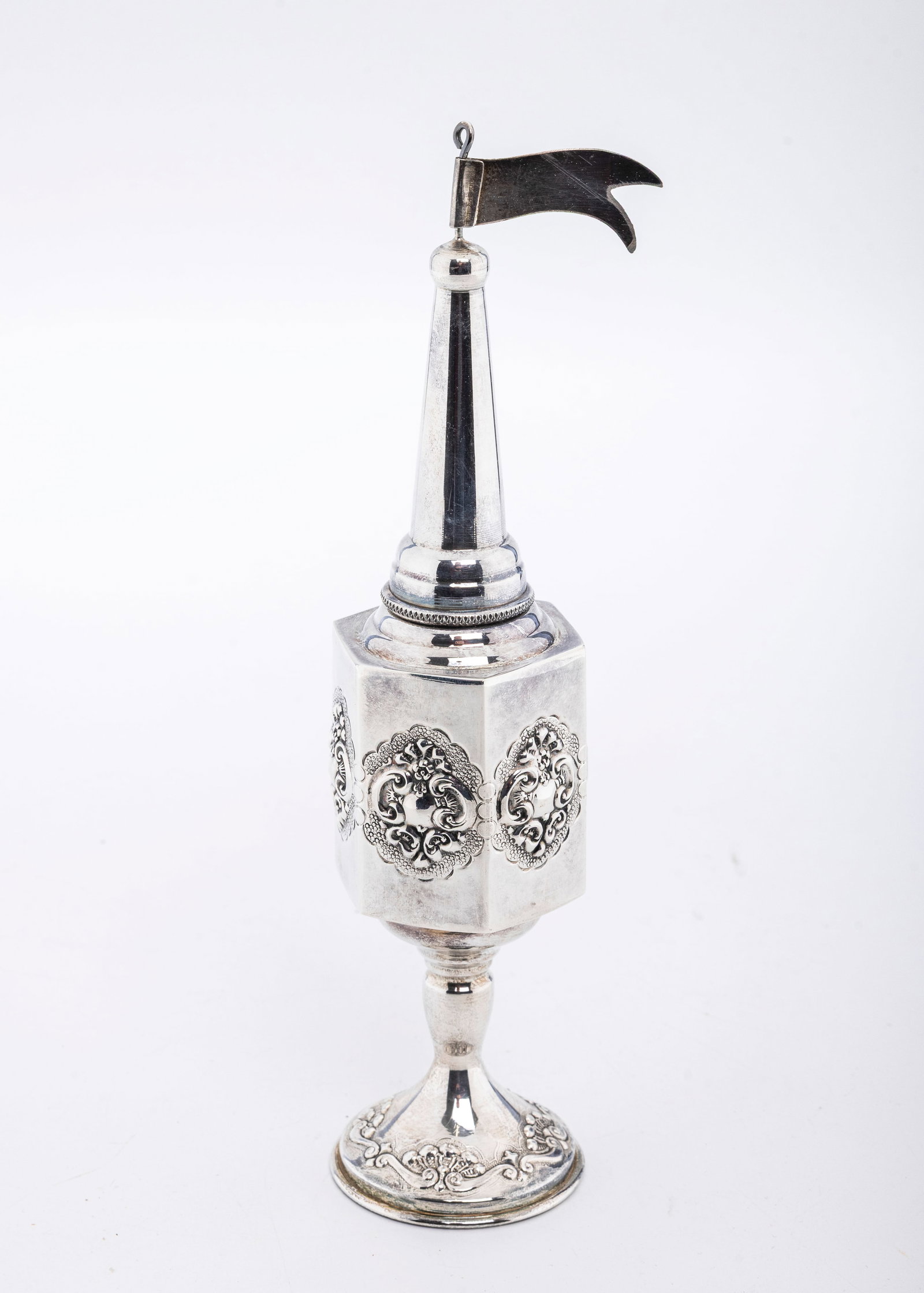 A STERLNG SILVER SPICE CONTAINER. Probably Israel, modern.: On a round base with an embossed octogonal body. Marked ST925.77.4 grams and 8.7" tall.