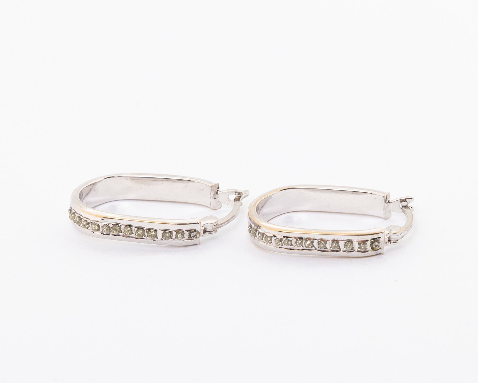 A PAIR DIAMOND EARRINGS: In hoop style. 1.5 dwt.