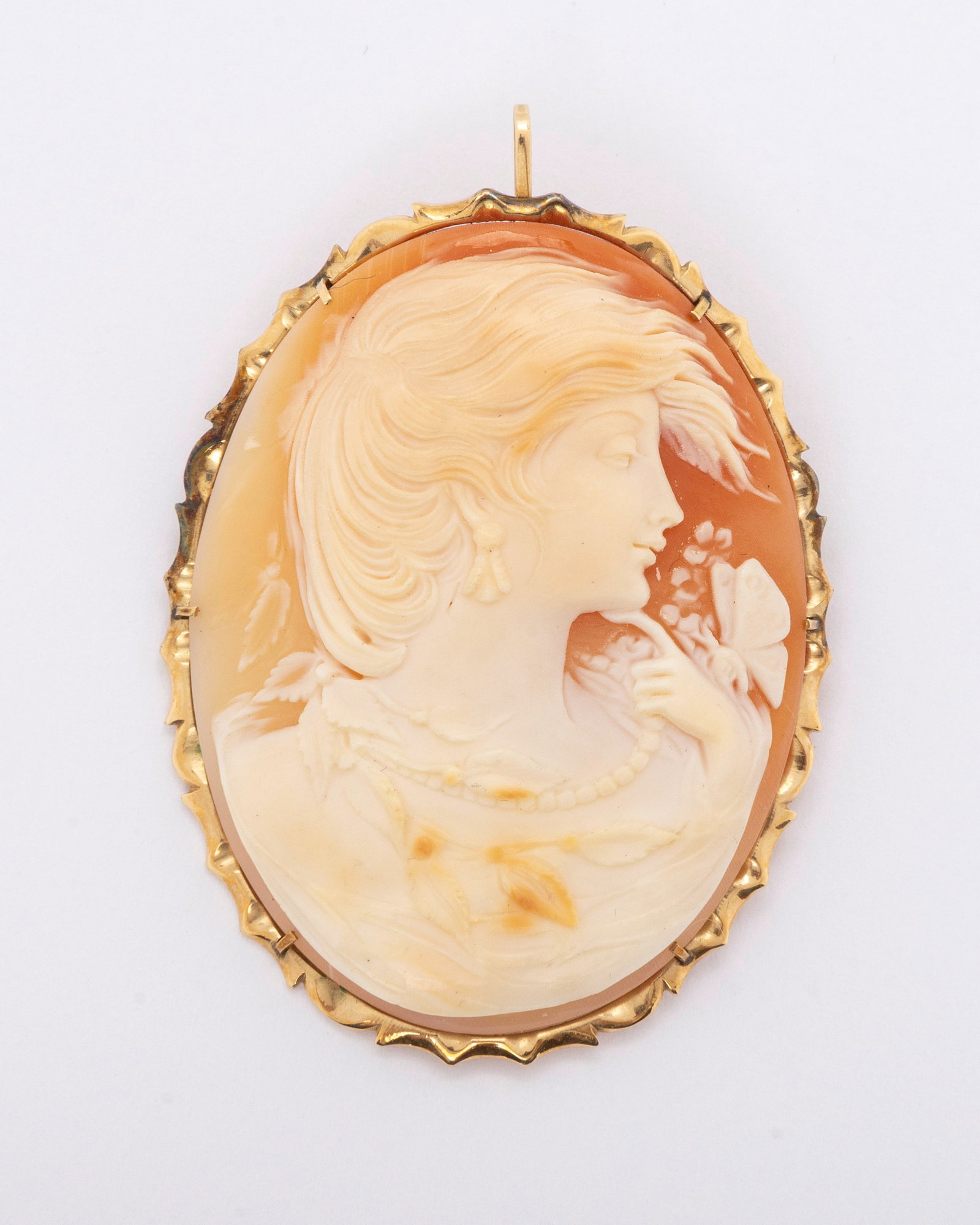 A LARGE HAND CARVED CAMEO IN A 14k FRAME: Classic Victorian cameo hand carved. Housed in a 14K fram. 2.25" x 1.75"