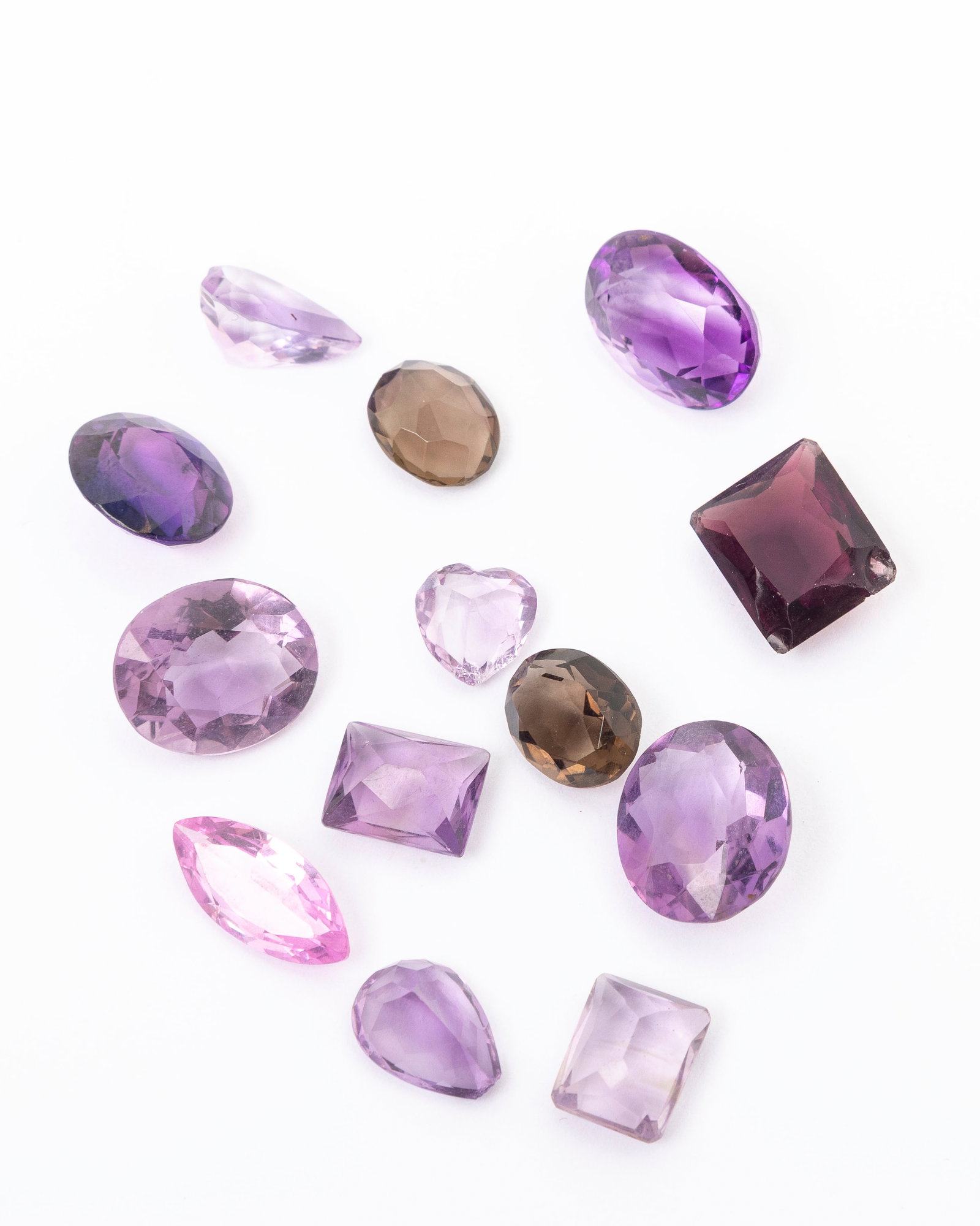A GROUP OF CUT AMETHYSTS: 13 pieces totallung 55 carats.