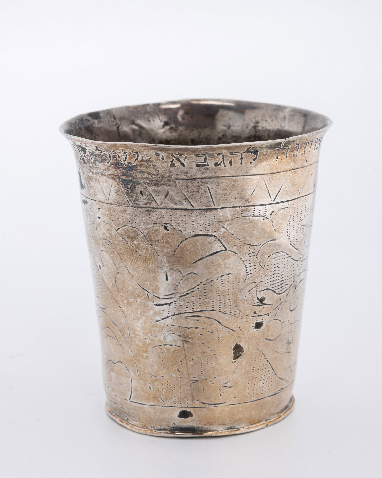 AN ANTIQUE SILVER KIDDUSH BEAKER.: Decorated with a running stag. Upper lip engraved with Hebrew dedication. 3" tall and 68.2 grams