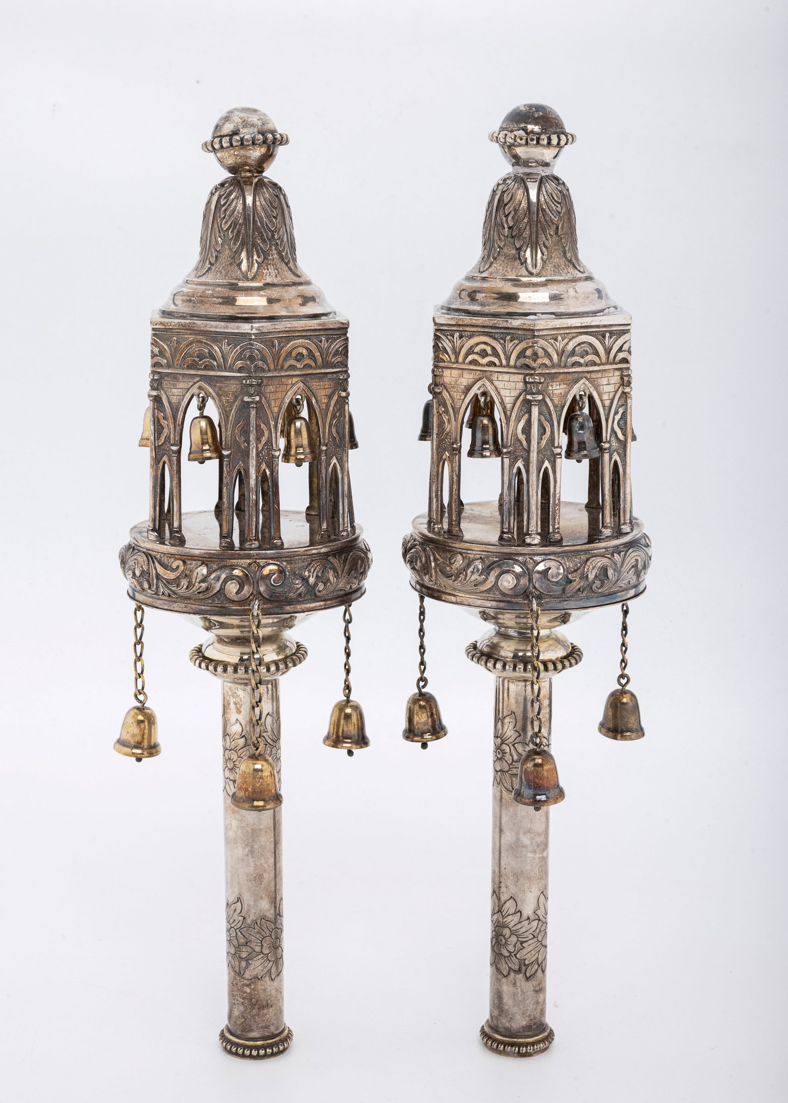A LARGE AND HEAVY PAIR OF STERLING SILVER TORAH FINIALS BY MICHAEL STRAUSS: In the style of Maurice Meyers of Paris, France. In gothic form fitted with chains and bells. Marked and signed. 1310 grams total weight. 14.8" tall each.
