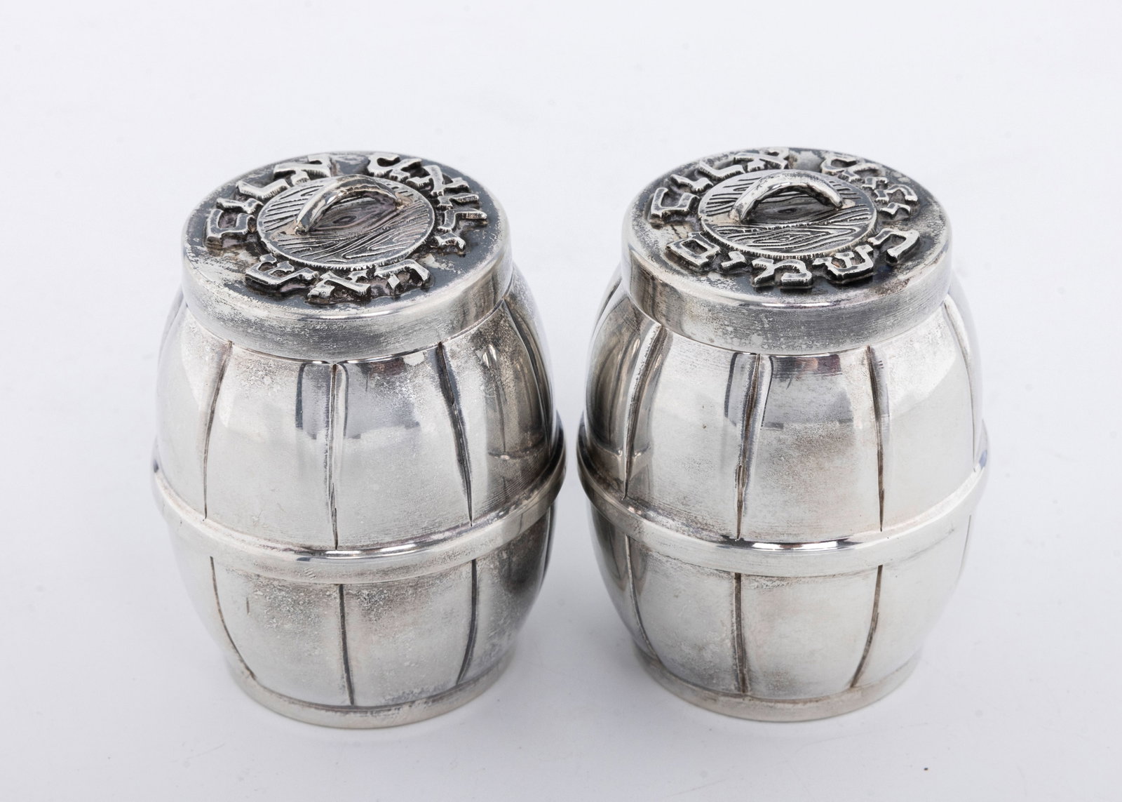 A STERLING SILVER HAVALDAH SET. Probably Israel, modern.: Barrel form. With a spice container and a candle holder. 2.5" tall each and total weight of 151.8 grams