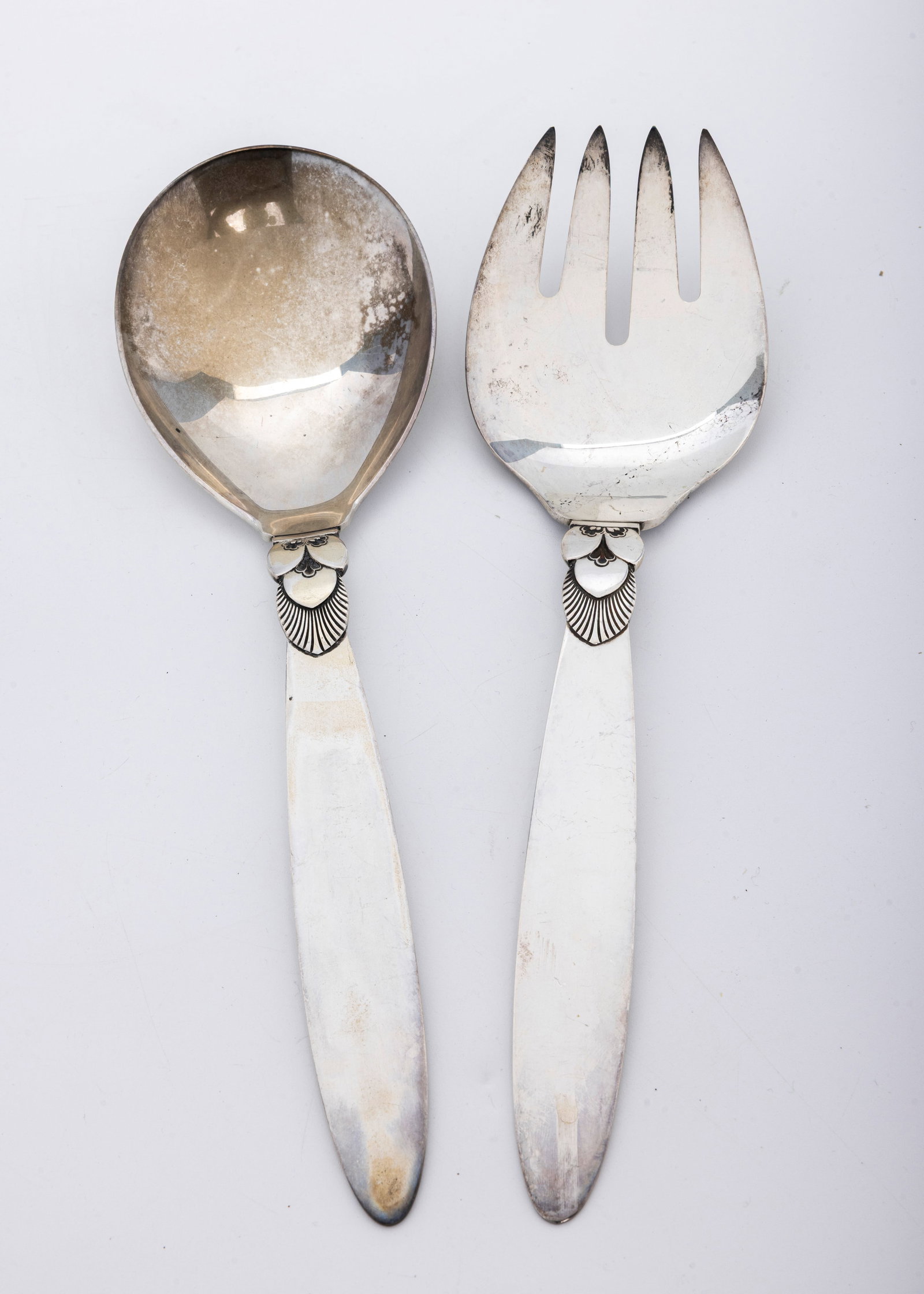 A MASSIVE PAIR OF STERLING SILVER SALAD BY GEORG JENSEN CACTUS. Denmark.: Just under 11" long each. In excellent condition. Total weight is 310.5 grams