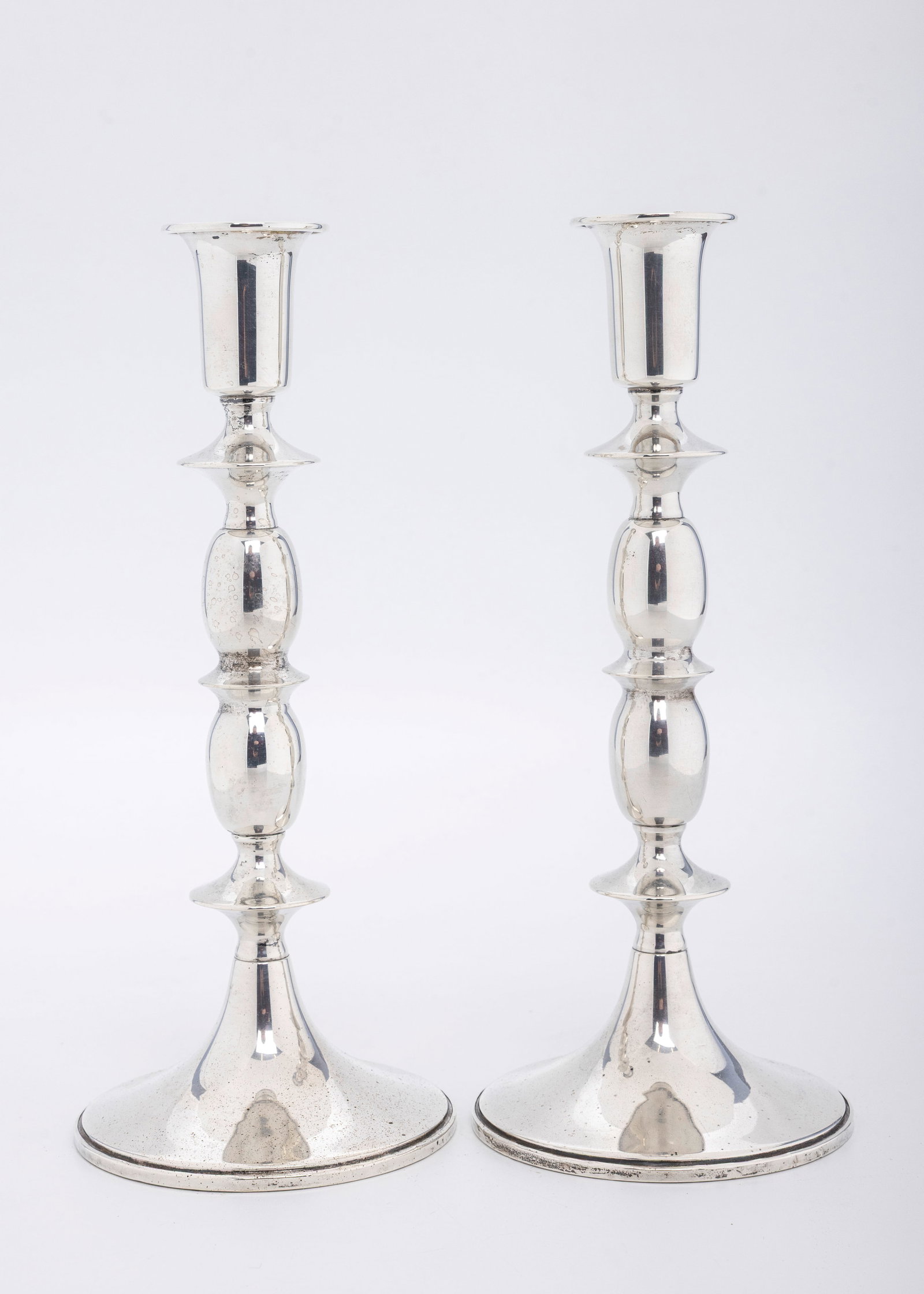 A PAIR OF SILVER WEIGHTED CANDLESTICKS. American, c. 1960 (1 of 4)