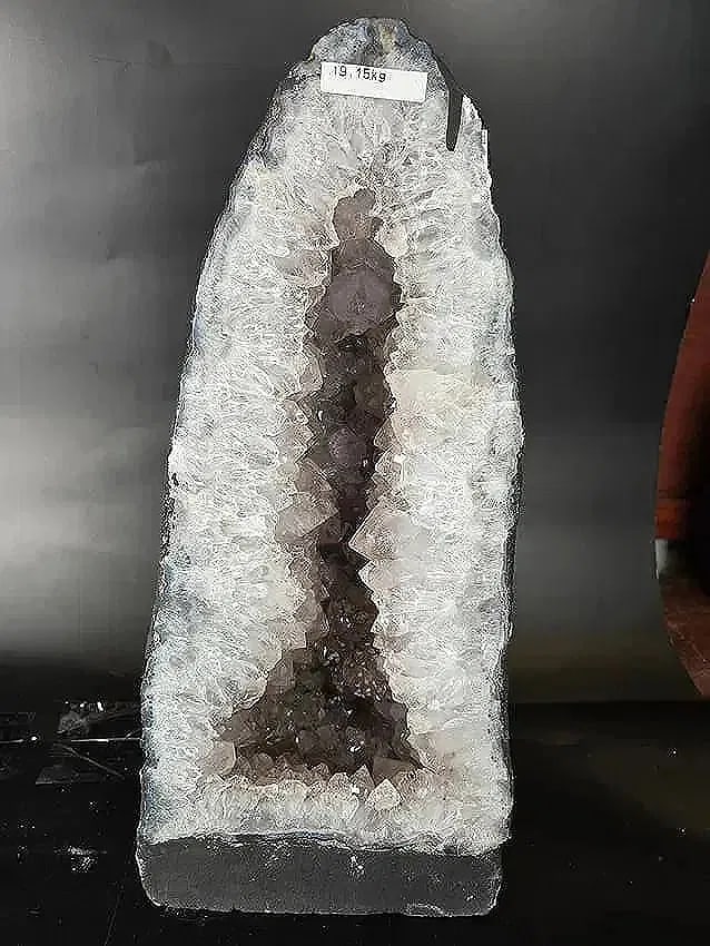 AMETHYST CATHEDRAL GEODE WITH POLISHED EDGES: 17" tall X 8" at its widest. It weighs 19.5 KILOGRAMS