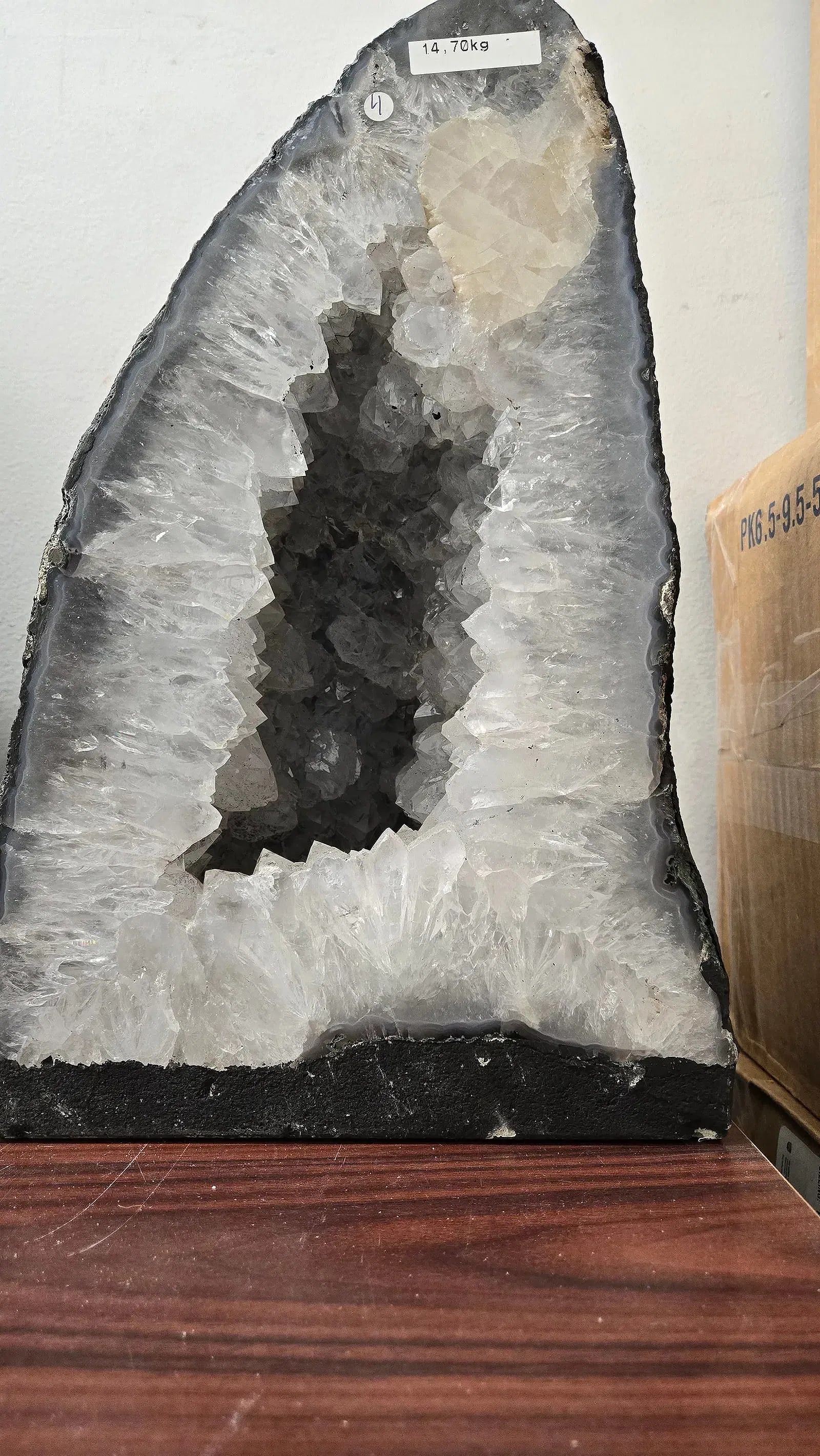 AN AMETHYST GEODE WITH POLISHED EDGES.: In traditional form. 14.7 kilograms and 13" tall