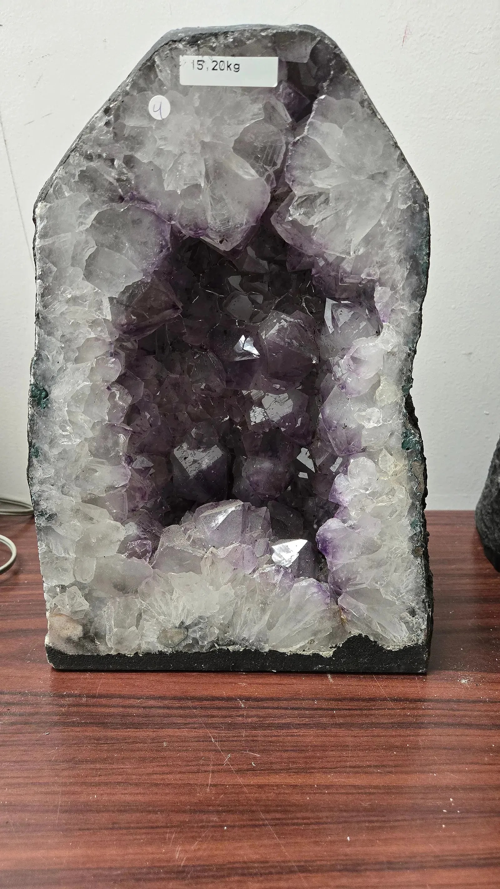 AN AMETHYST GEODE WITH POLISHED EDGES.: In traditional form. 15.2 kilograms and 12" tall