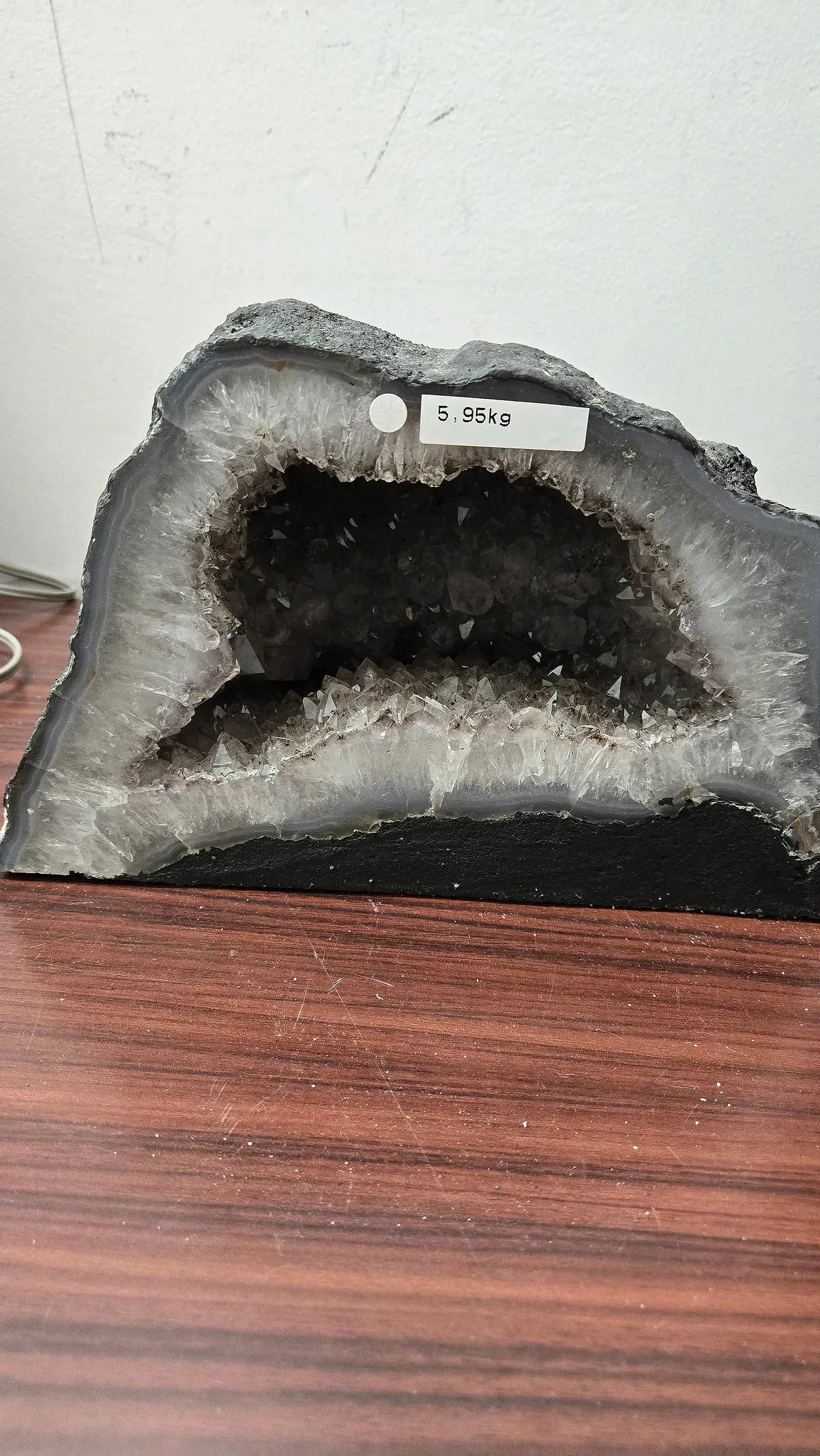 AN AMETHYST GEODE WITH POLISHED EDGES.: In traditional form. 5.95 kilograms and 6.5 tall