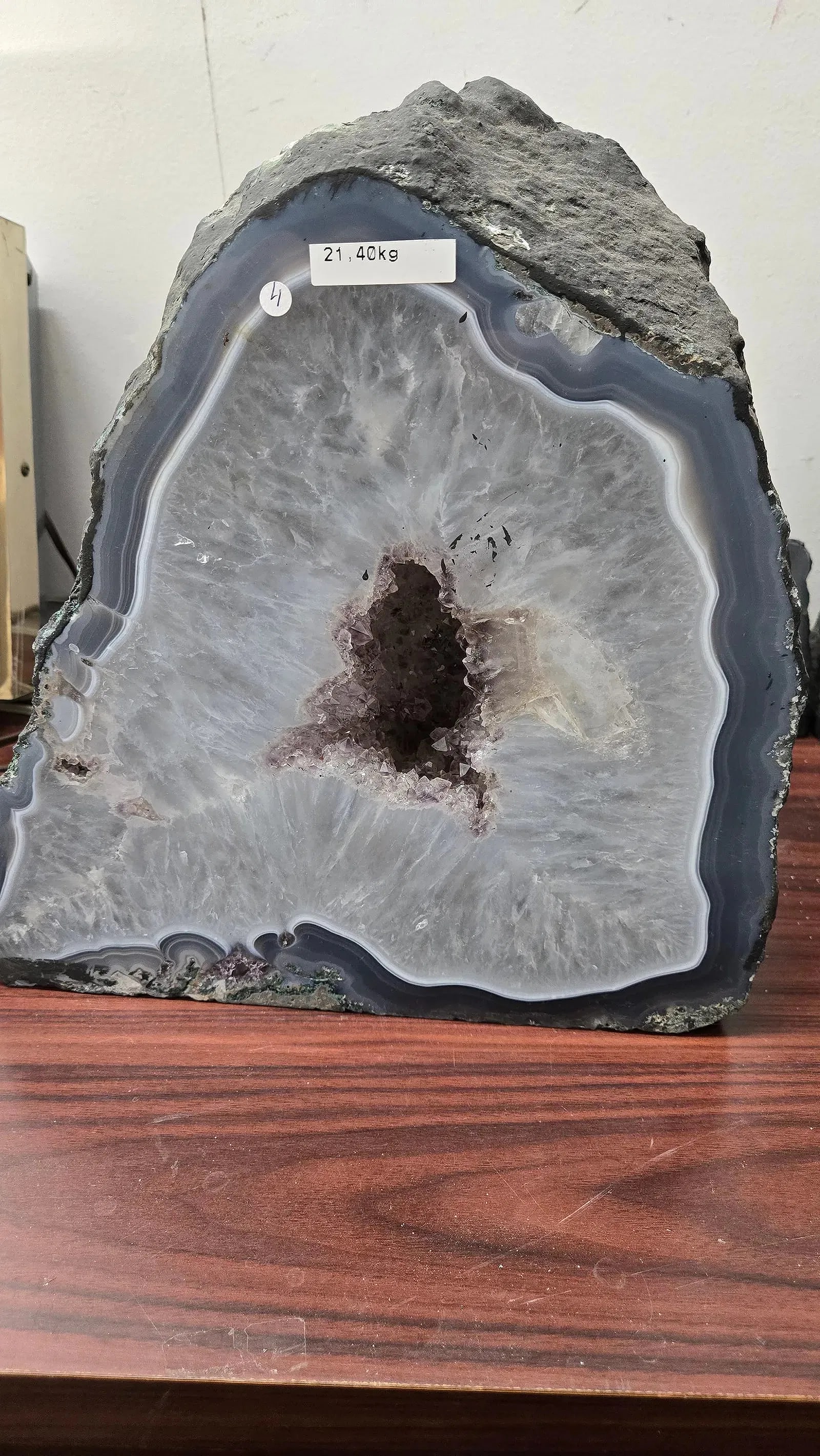 AN AMETHYST GEODE WITH POLISHED EDGES.: In traditional form. 21.40 kilograms and 11.5" tall