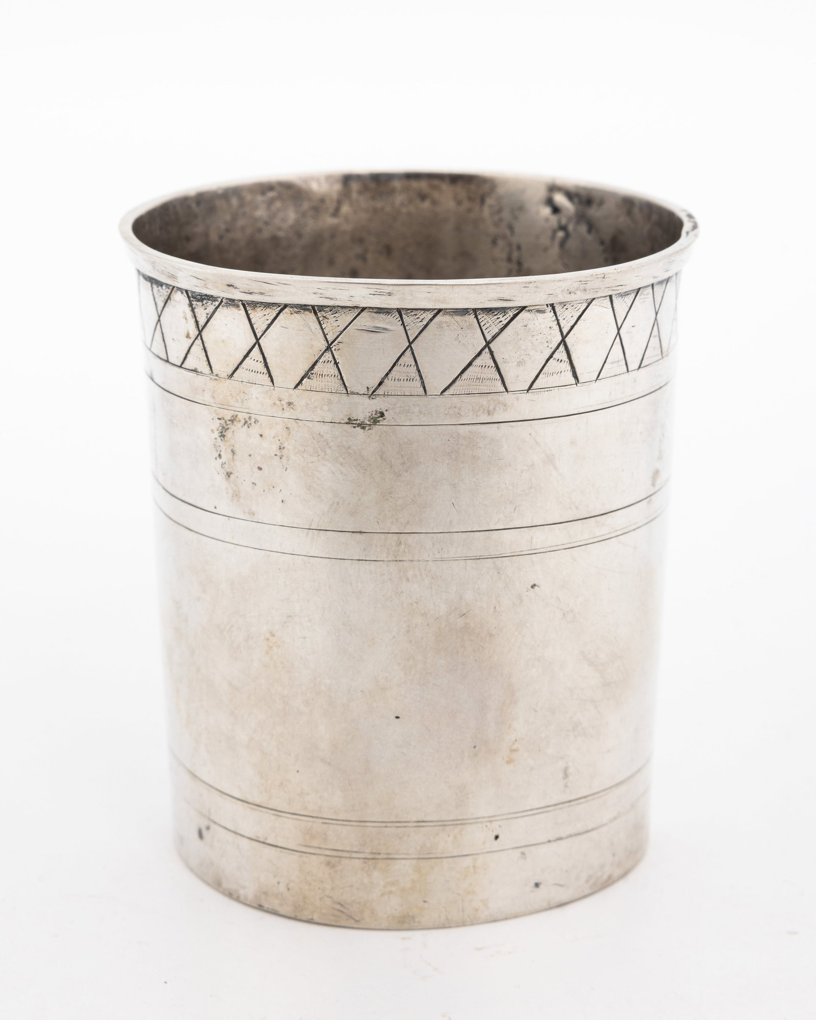 A LARGE SILVER KIDDUSH BEAKER. Germany, 18th century.: A large cup. With the upper lip decrated with criss cross engraving. Marked with a 13 and a maker's mark. Leak is evident. 3" tall and 2.5" wide. 87 grams