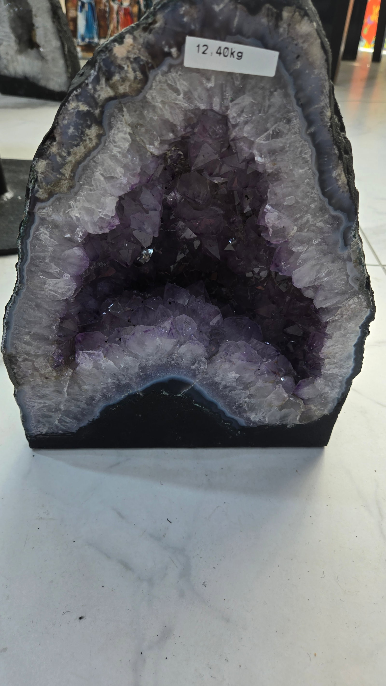 AN AMETHYST GEODE WITH POLISHED EDGES (1 of 4)