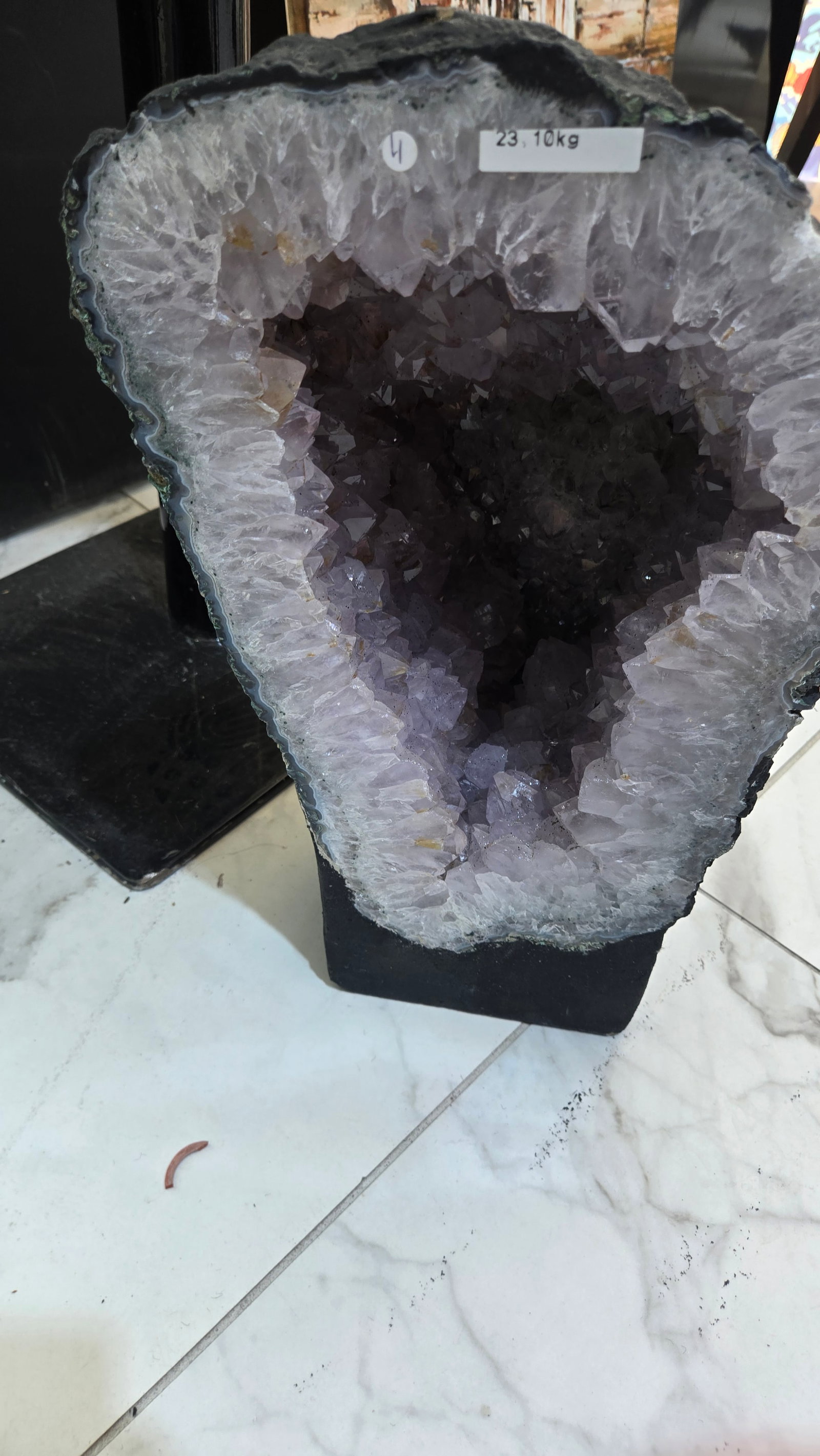 AN AMETHYST GEODE WITH POLISHED EDGES: 23.1 kg and 14" tall.