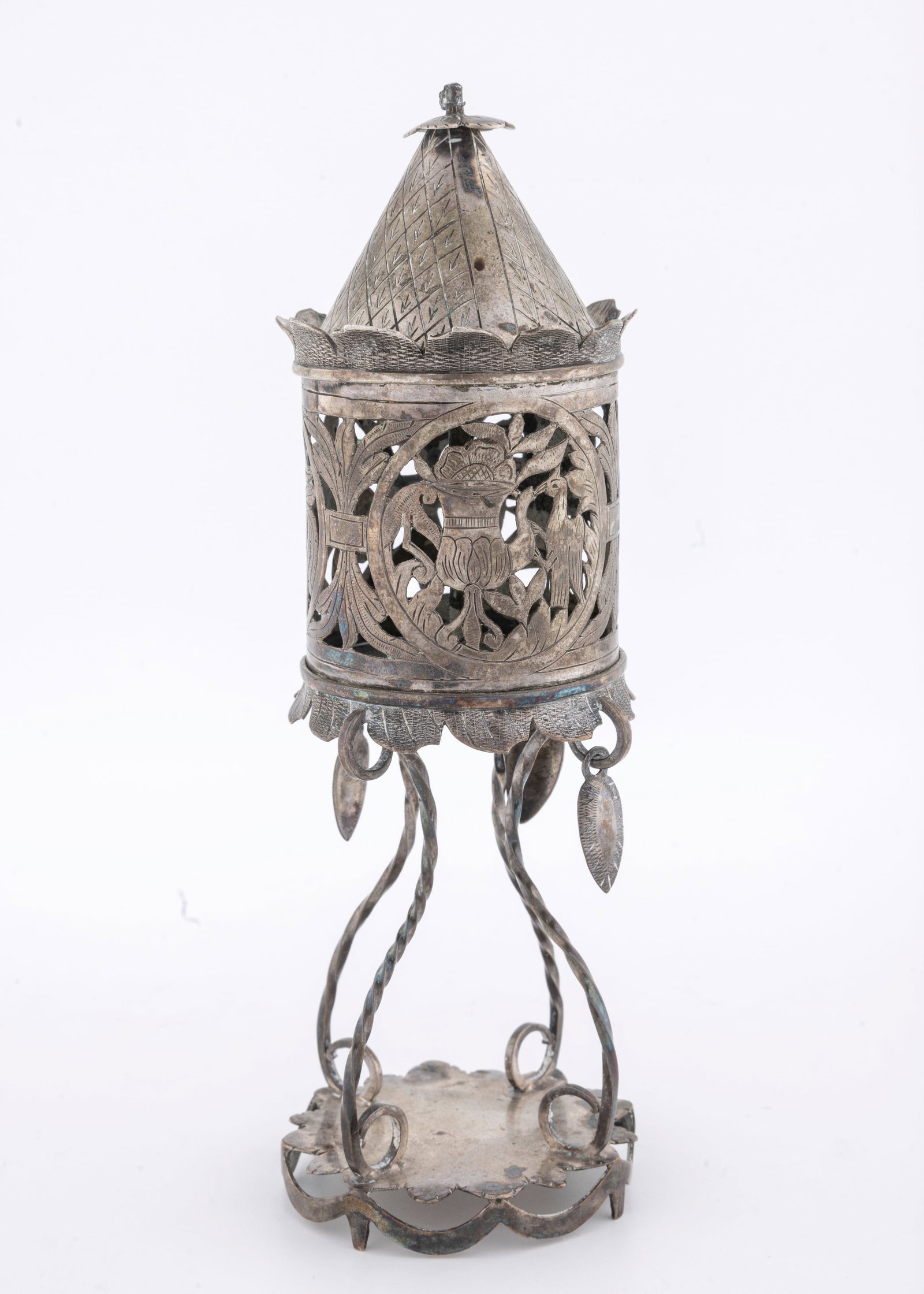 AN EARLY SILVER SPICE CONTAINER. Poland, c. 1840: On a sunflowe shaped supporting base with four wire supports that hold up the main spice section. The body is compsed of fine latticework with iconography including birds, scrolling desgns and flowers