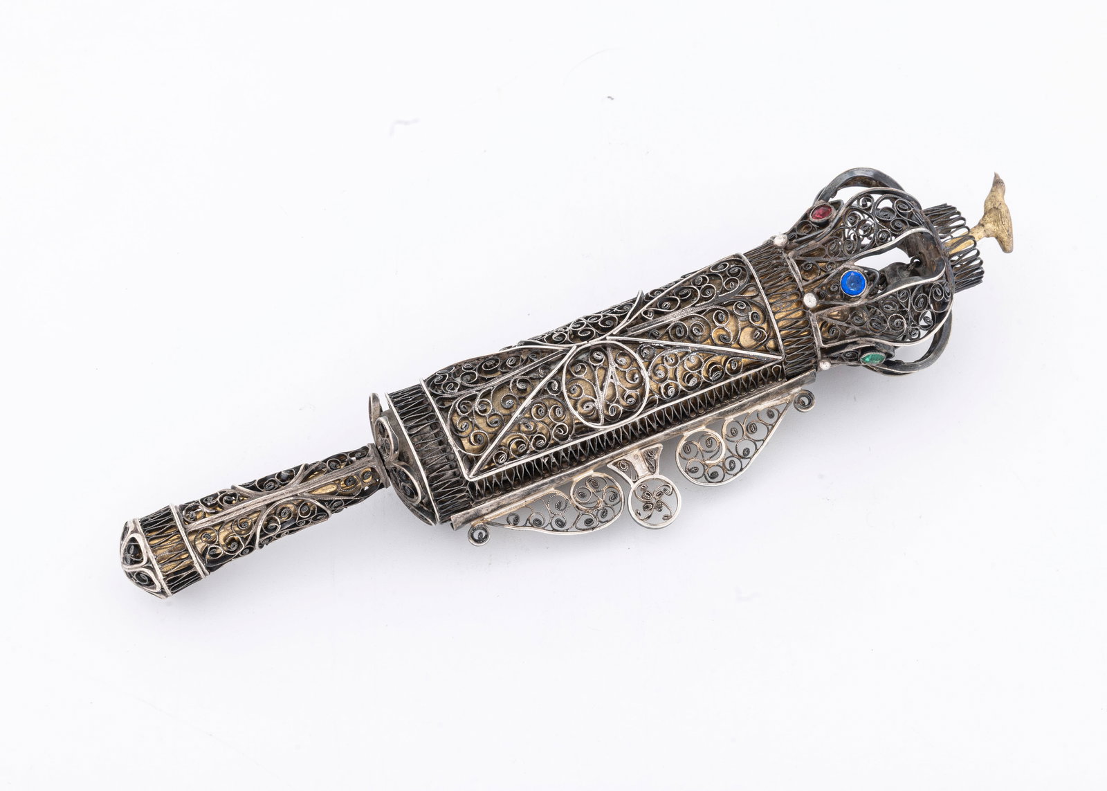 A FINE FILIGREE SILVER MEGILLAH CASE. Ukraine, c. 1830: Hand spun fine filigree megillah case overlaying a gilded tubular protective structure. Apparantly the original megillah which is now detached and in poor condition is encased. 
