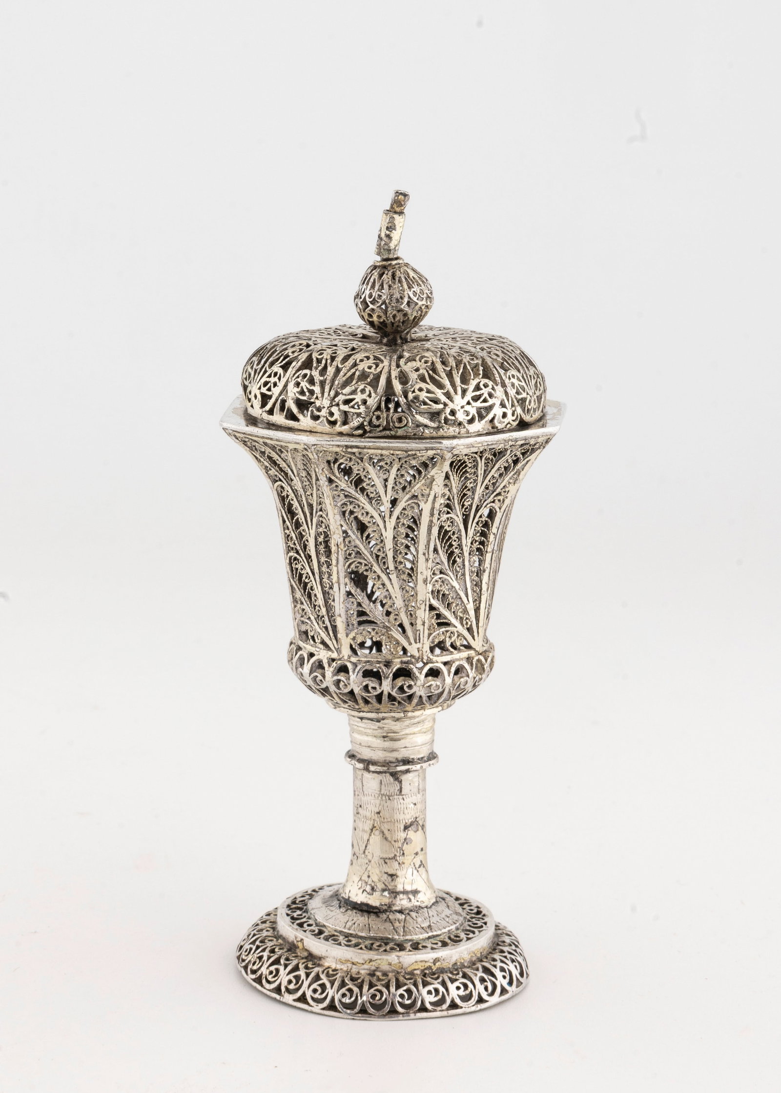 A SILVER SPICE CONTAINER. Russia, 1860: Traditional form. With urn shaped upper portion. Composed completely of filigree. Marked 91 (quality of the silver). 
